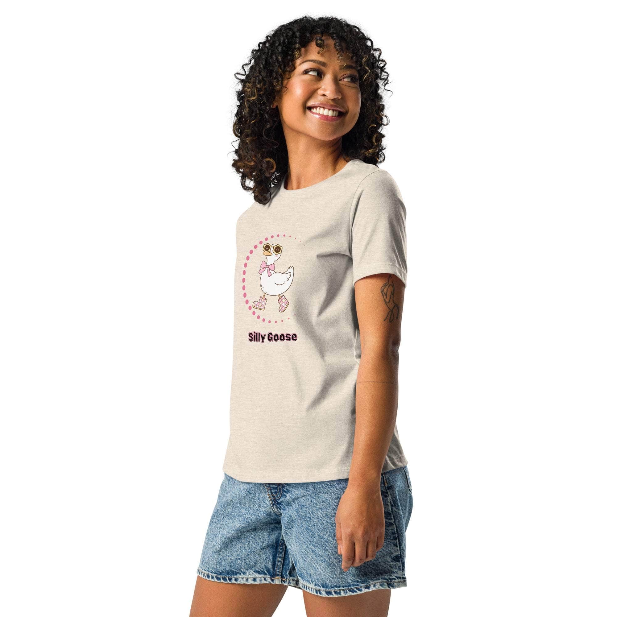 Woman wearing a beige Silly Goose Graphic T-Shirt with a playful illustrated goose and text, paired with denim shorts