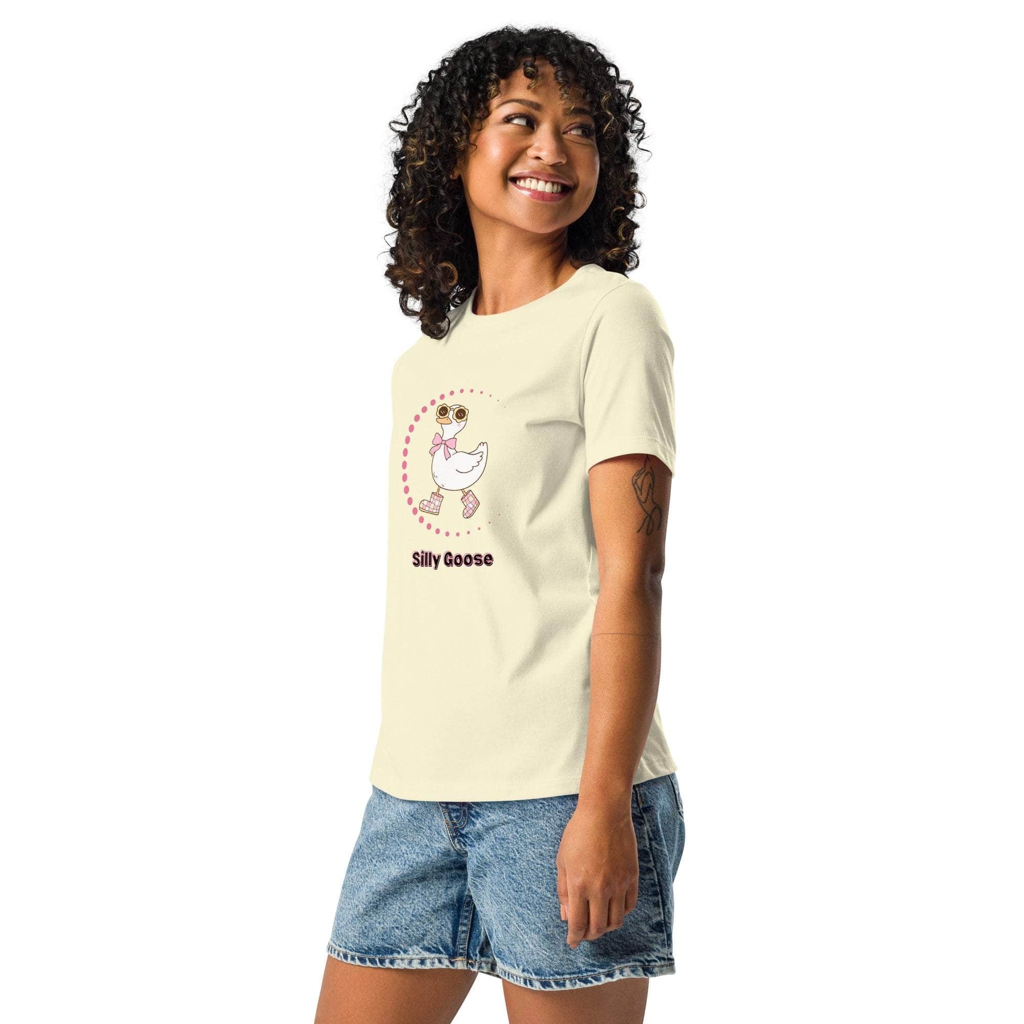 Woman wearing cream Silly Goose Graphic T-Shirt with playful illustrated goose and text, paired with denim shorts