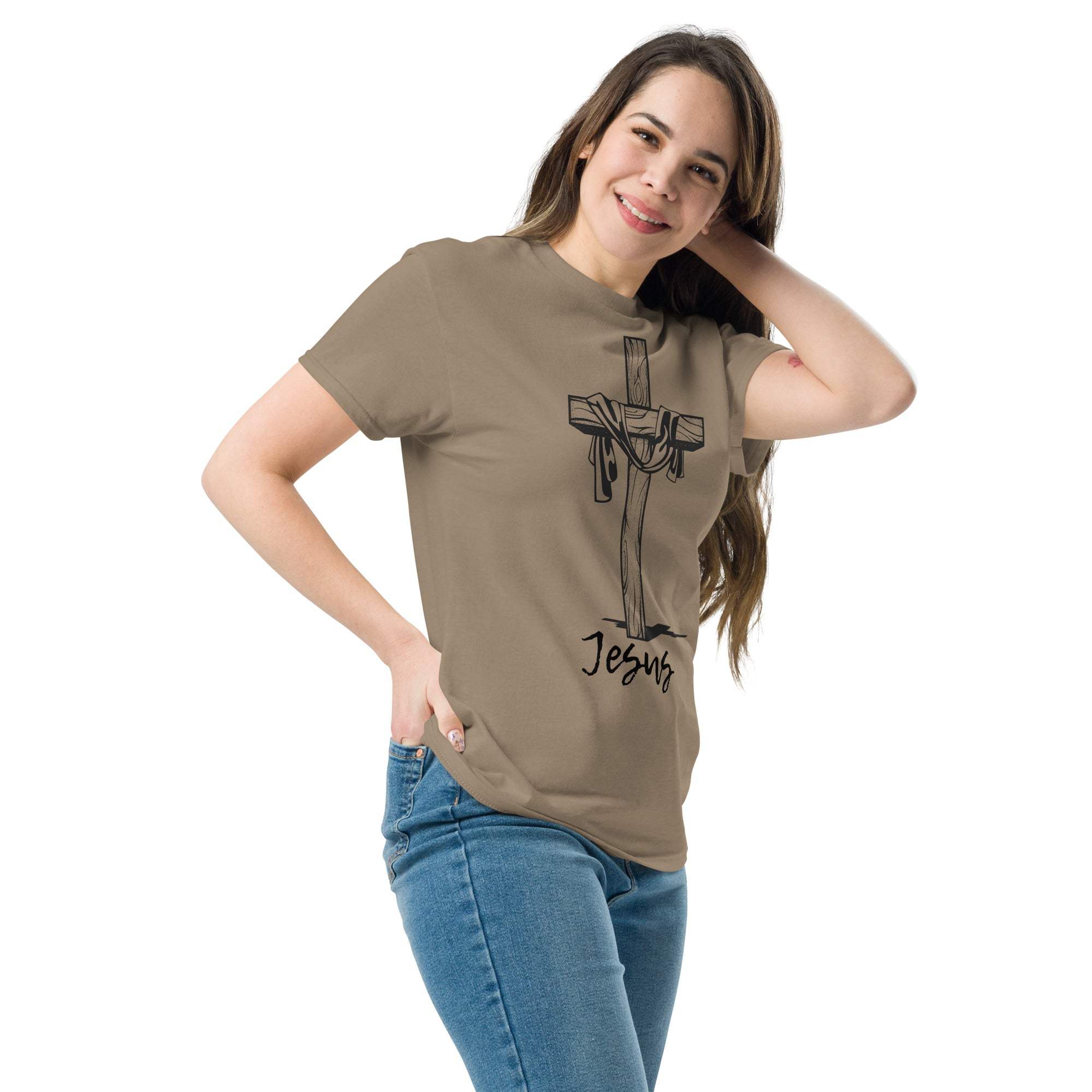 Woman wearing a brown Christian Cross T-Shirt featuring a cross graphic and Jesus text, paired with blue jeans.