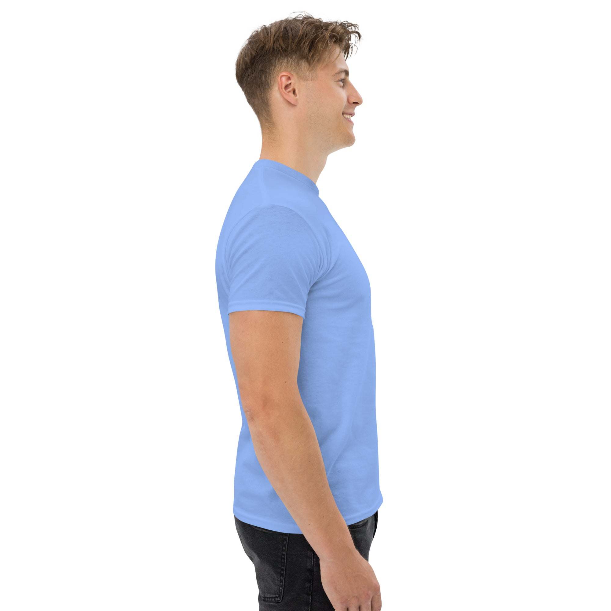 Side view of man wearing light blue trendy graphic t-shirt in casual streetwear style
