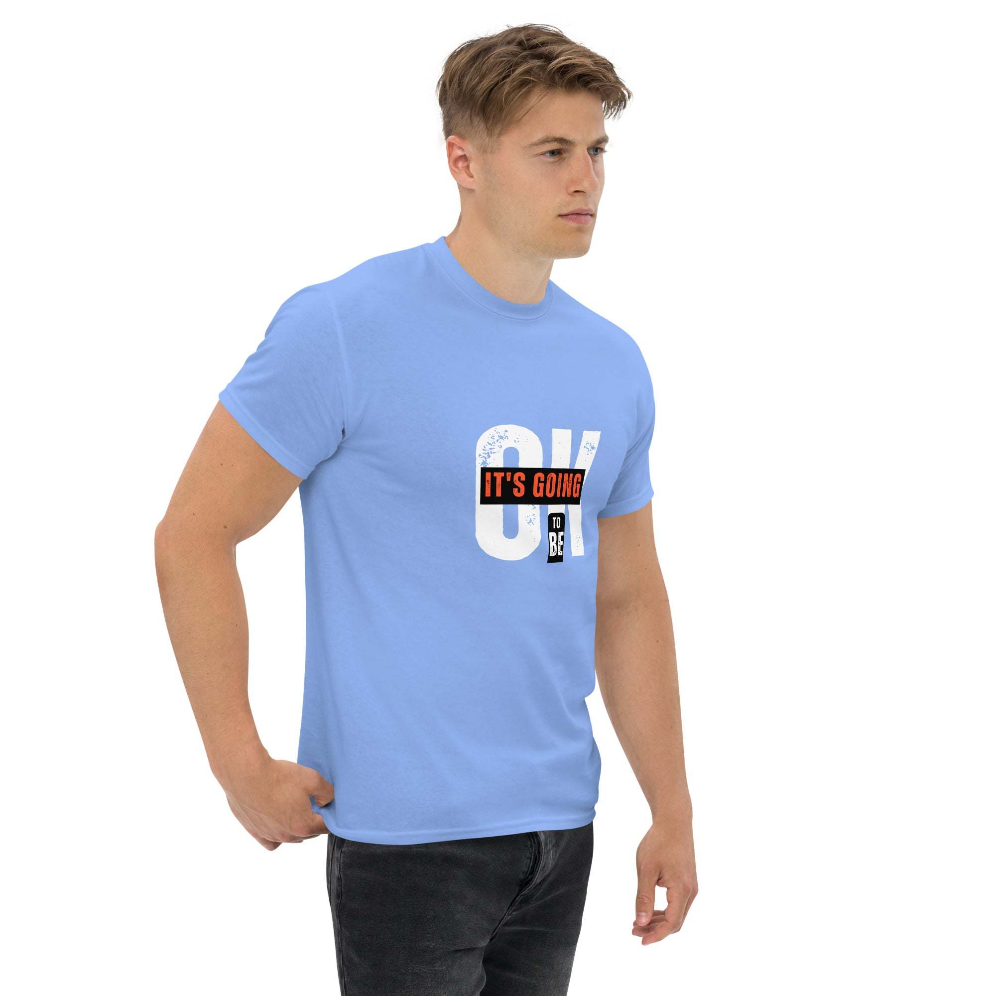 Man wearing blue trendy graphic t-shirt with motivational quote print, casual streetwear style