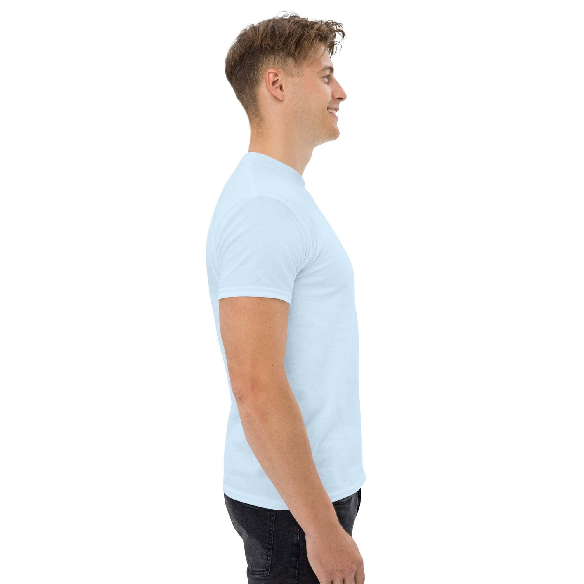 Side view of man wearing light blue trendy graphic t-shirt with short sleeves and casual fit