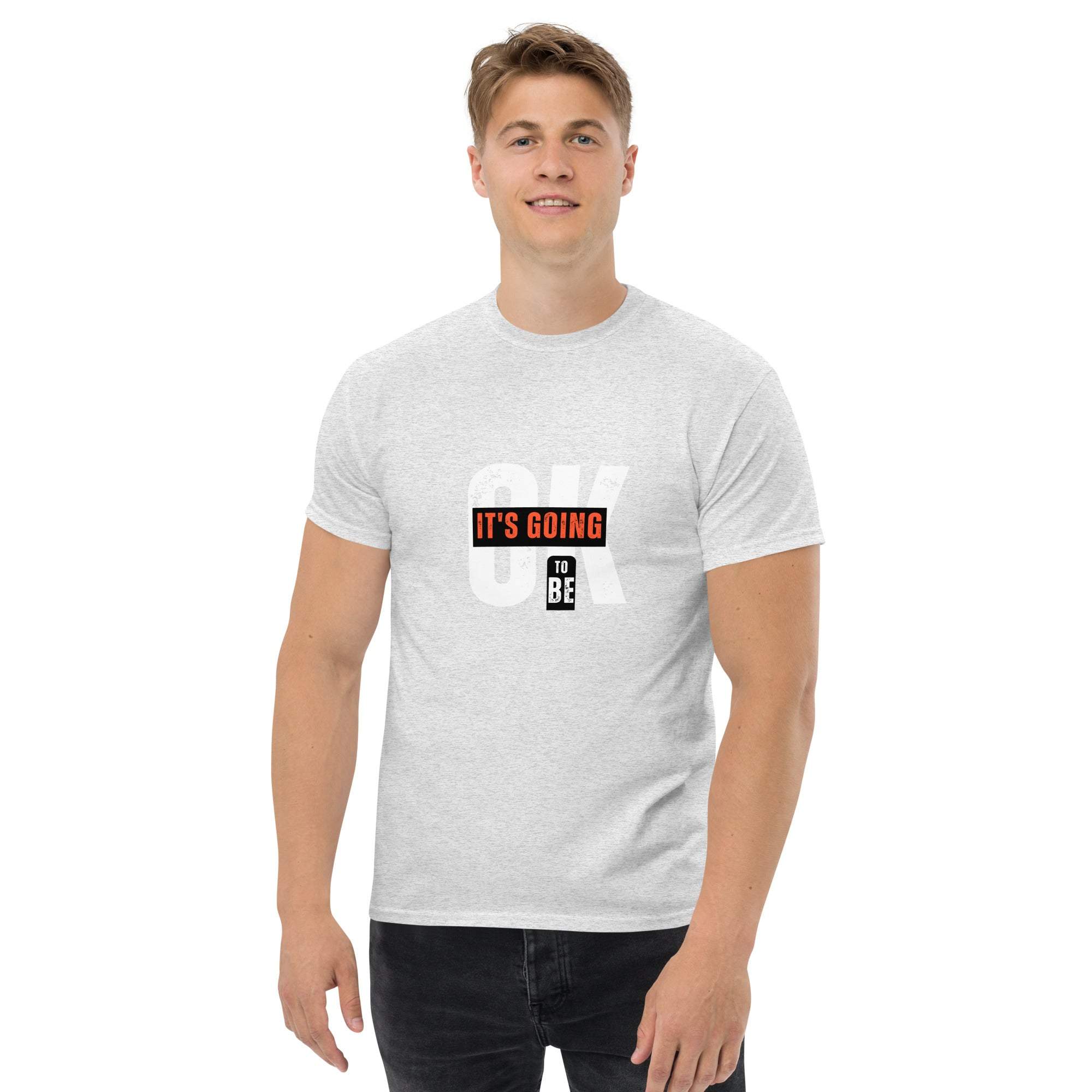 Man wearing trendy graphic t-shirt with motivational quote in casual summer streetwear style
