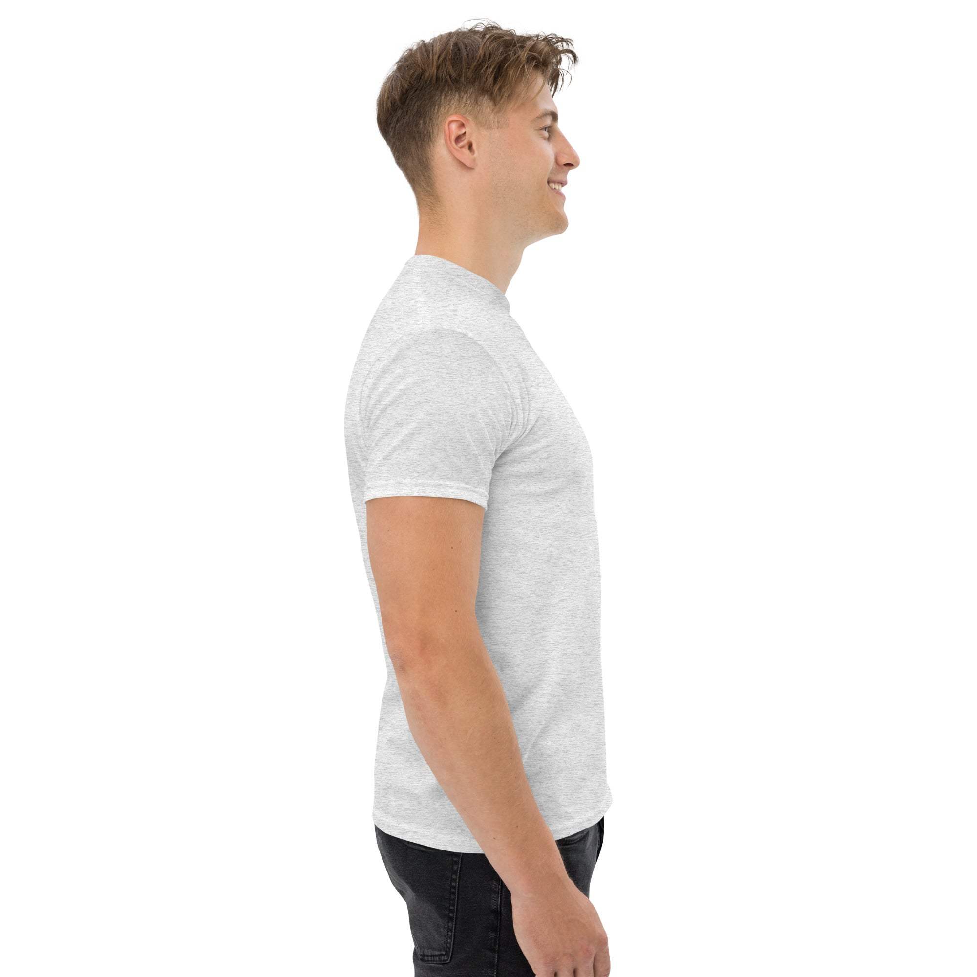 Side view of man wearing plain white trendy graphic t-shirt for casual street style summer outfit