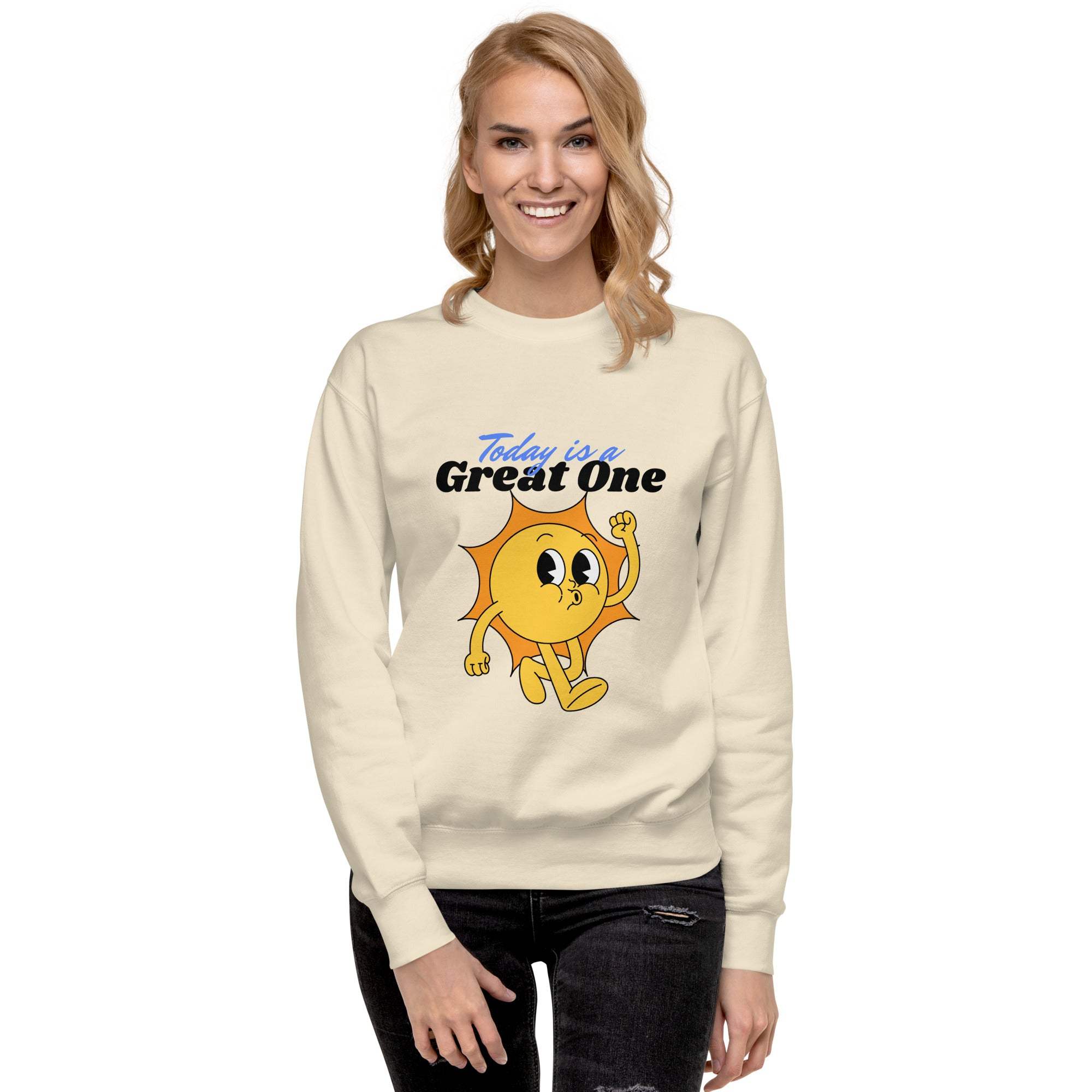 Woman wearing a Positive Sun Sweatshirt with a cheerful sun graphic and motivational text "Today is a Great One" in a comfortable unisex crewneck style