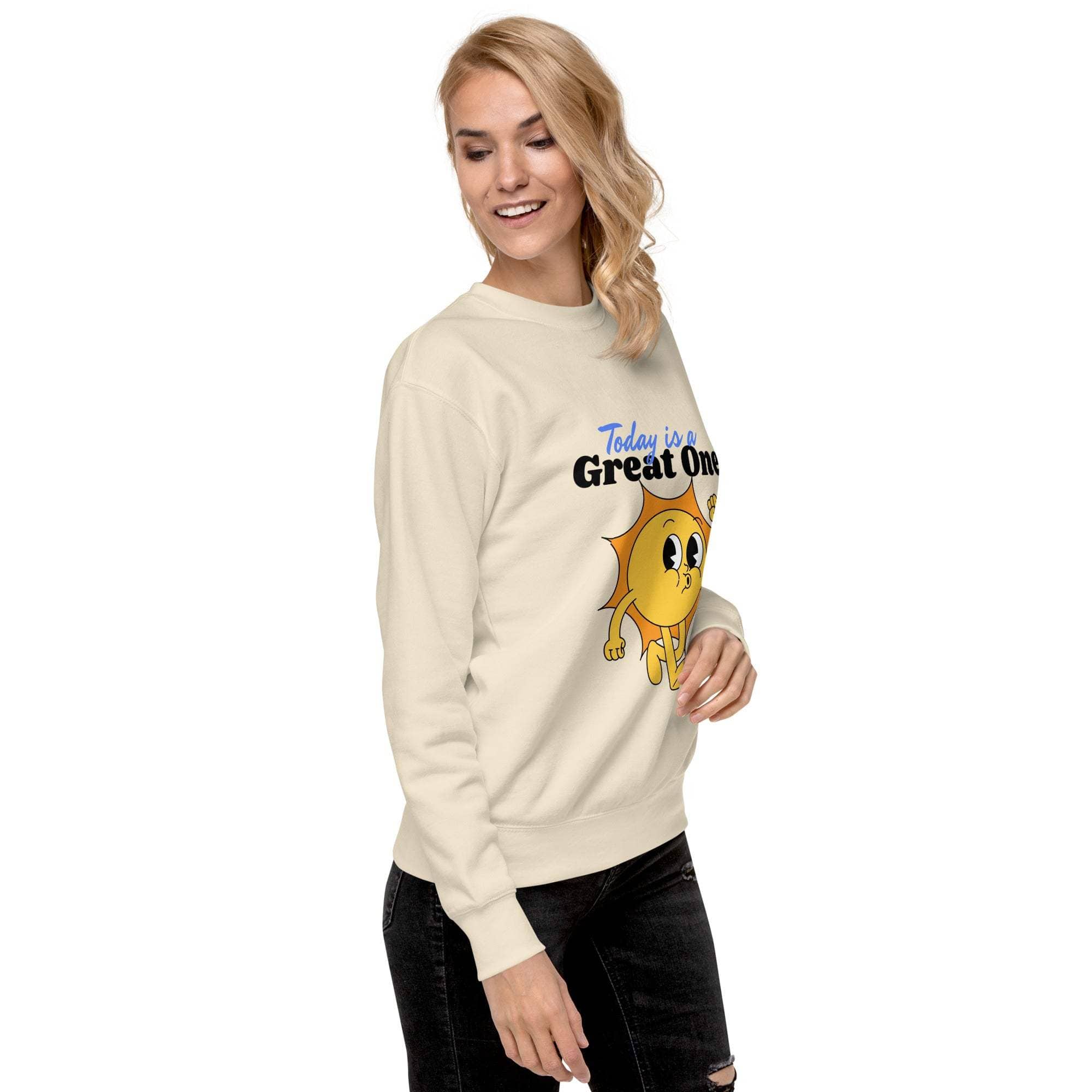 Woman wearing beige Positive Sun Sweatshirt with cheerful sun graphic and motivational text, casual unisex crewneck sweater