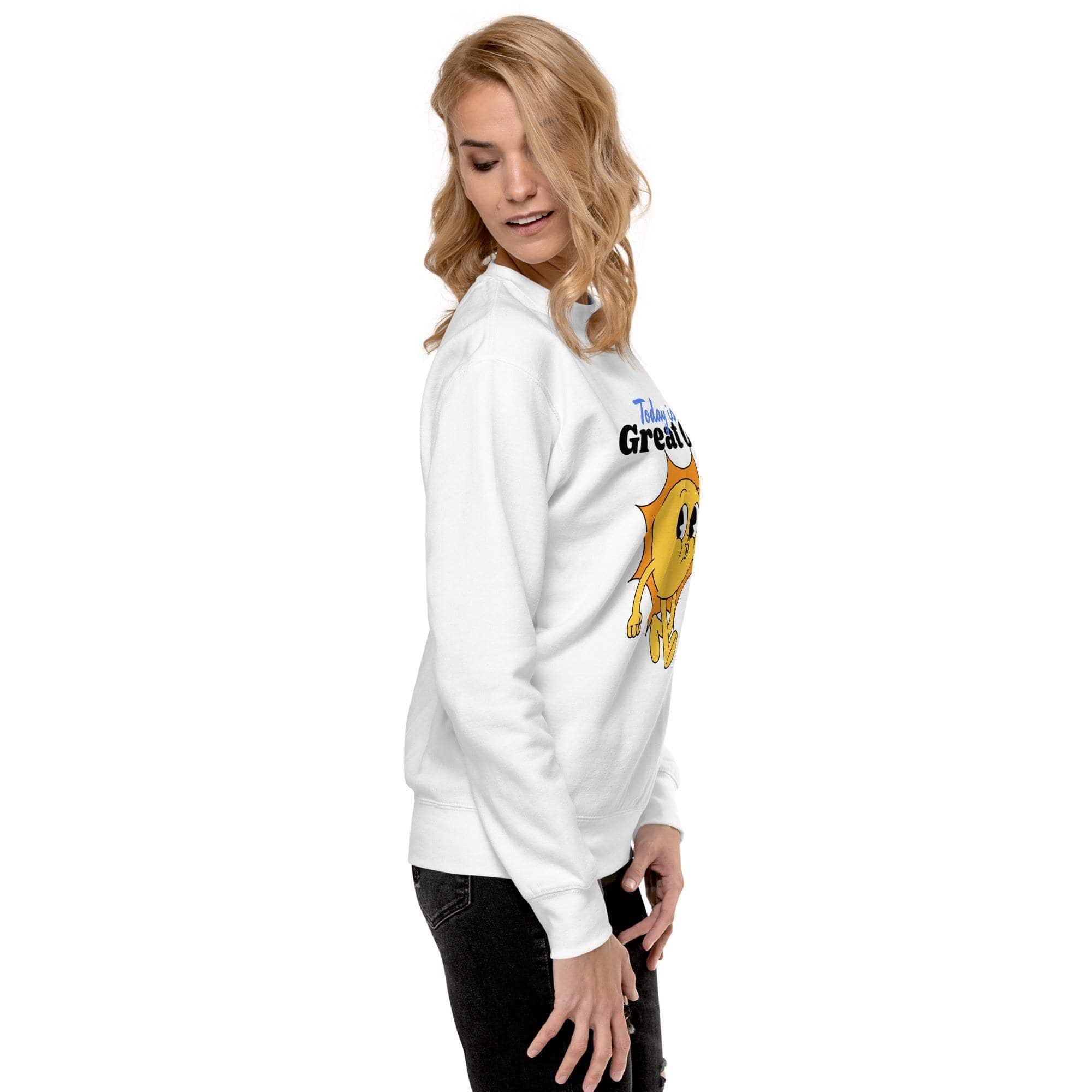 Woman wearing white Positive Sun Sweatshirt with cheerful sun graphic and motivational text, styled casually with black pants