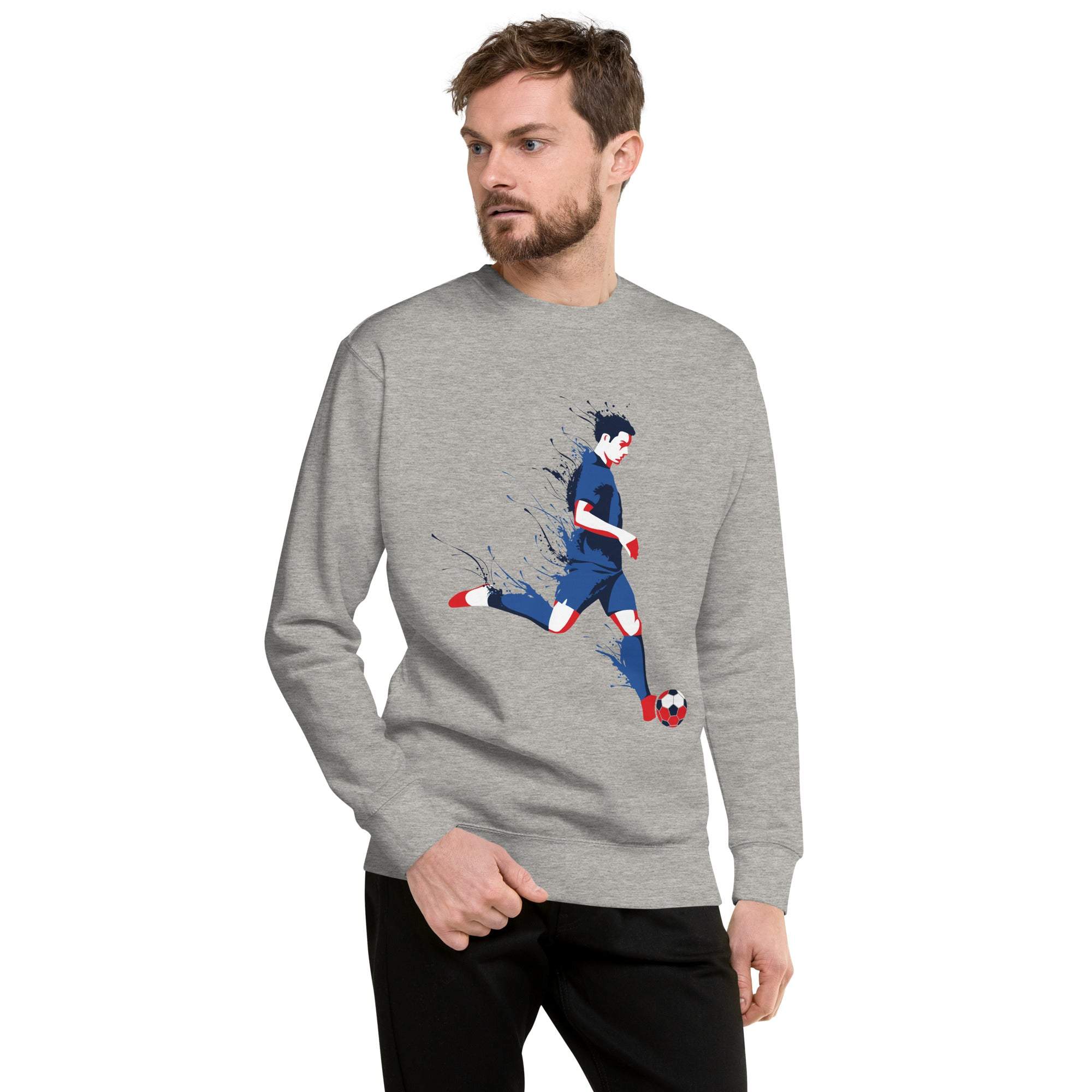 Gray soccer player sweatshirt with graphic of a soccer player kicking a ball, worn by male model