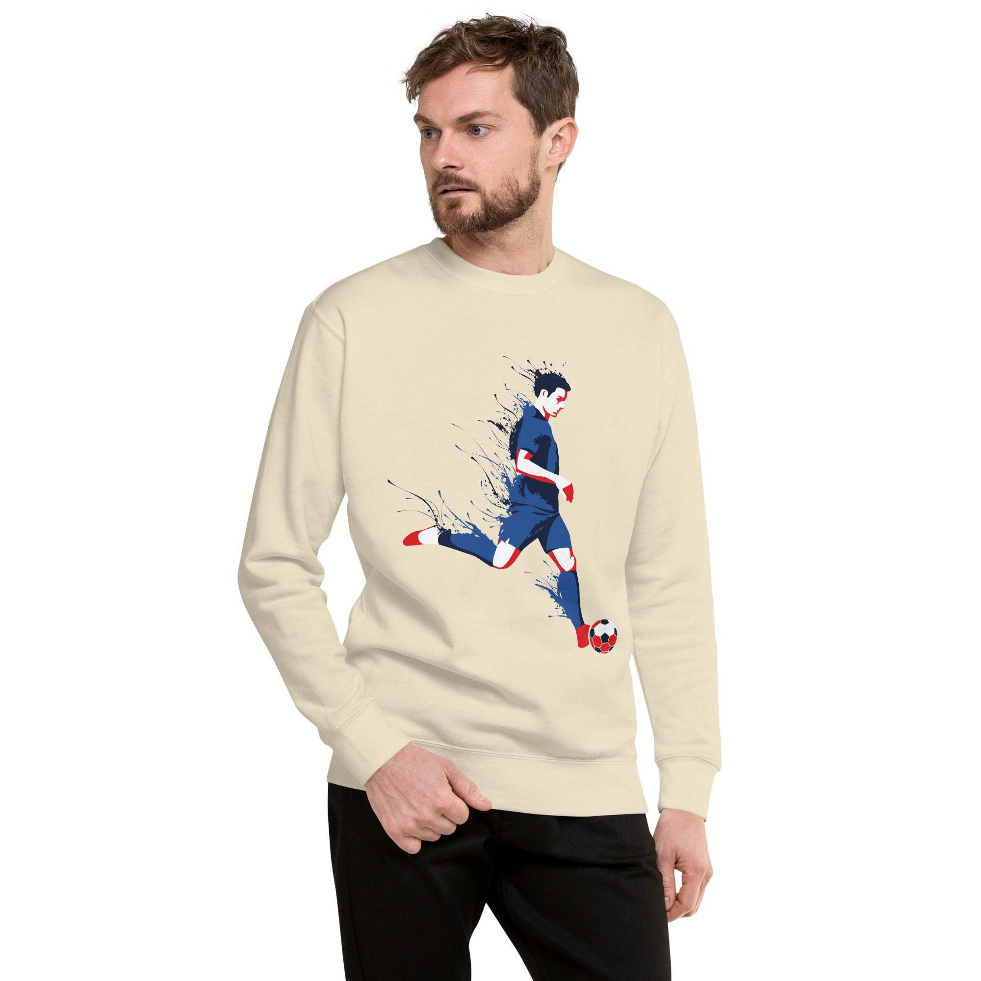 man wearing beige soccer player sweatshirt with dynamic soccer graphic on front