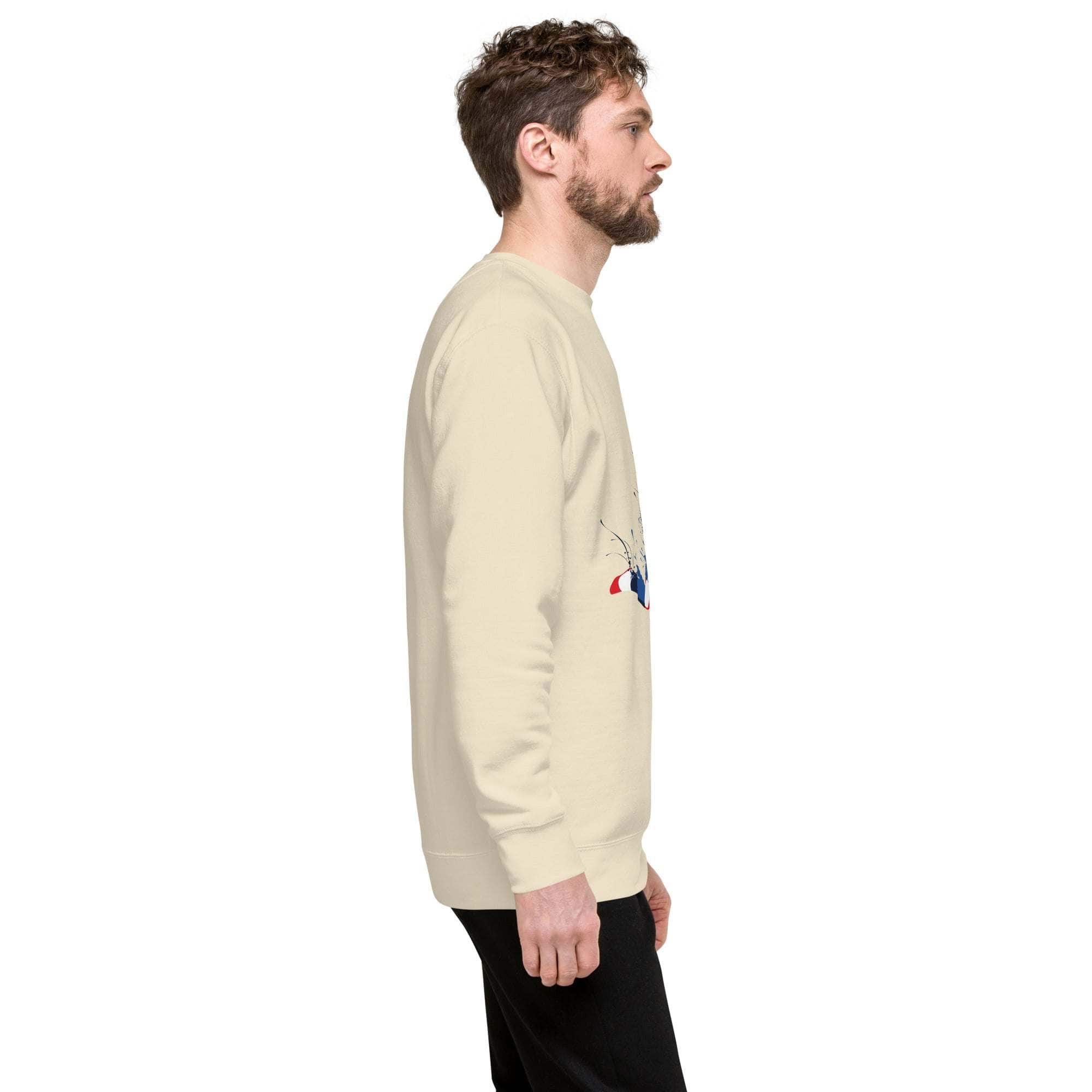 Side view of man wearing beige soccer player sweatshirt with sports graphic and black pants