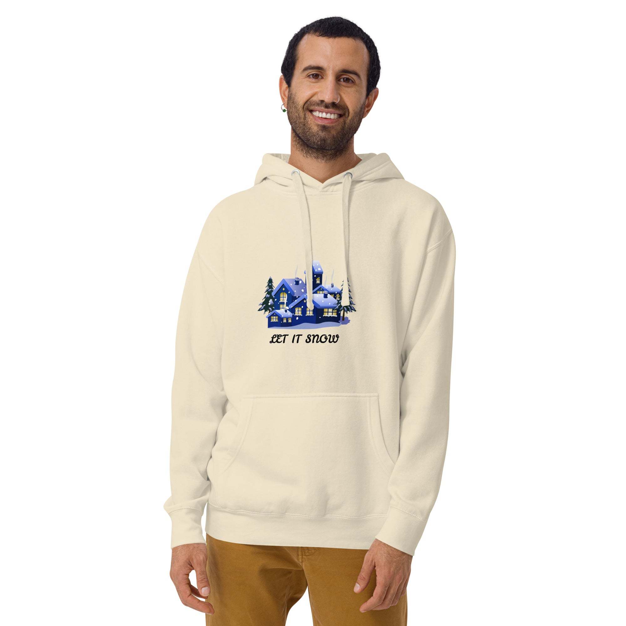 Man wearing cream Let It Snow Hoodie with snowy village print and front pocket