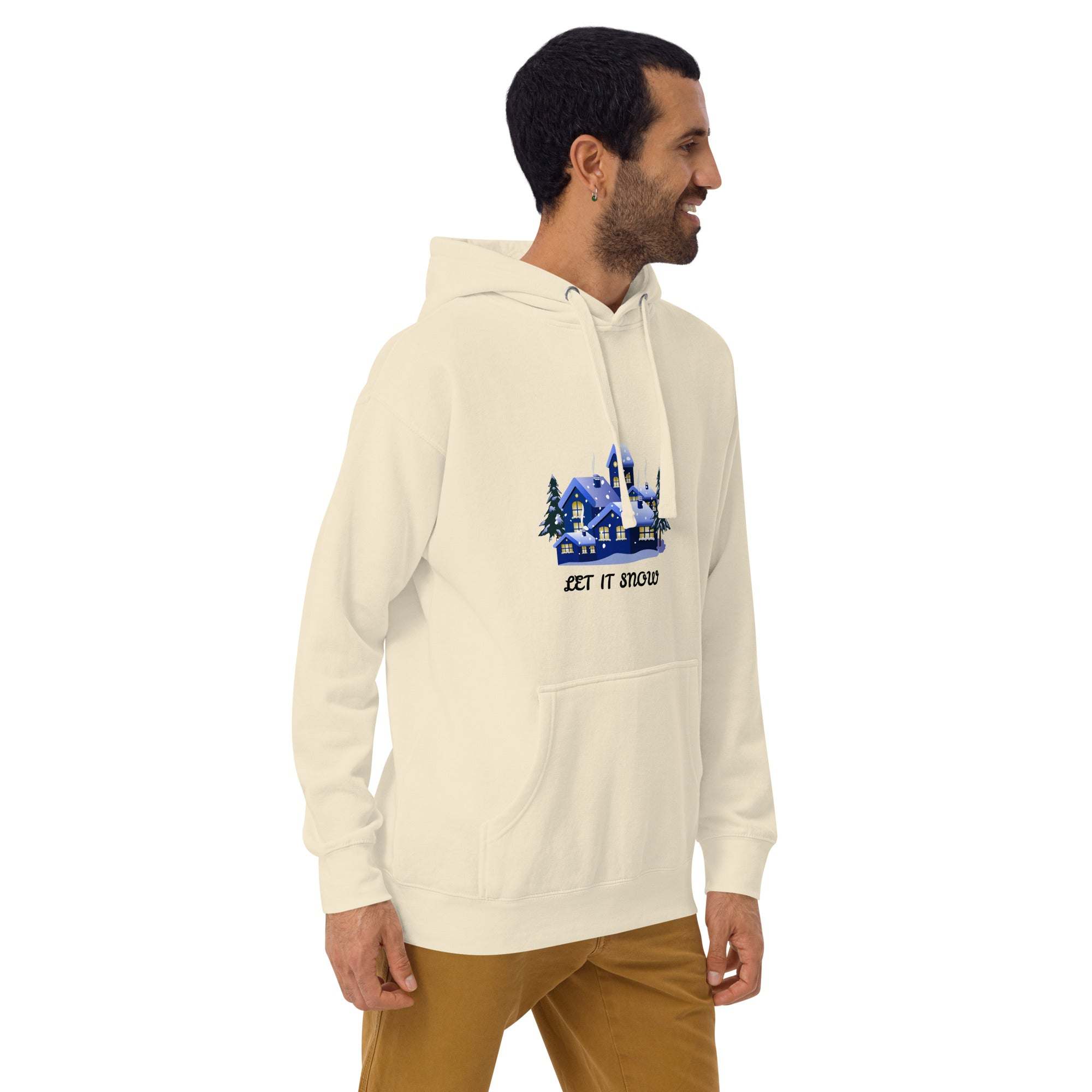 Men's Let It Snow Hoodie with snowy village design, cream color, front pocket, and adjustable hood, perfect for winter and Christmas wear.