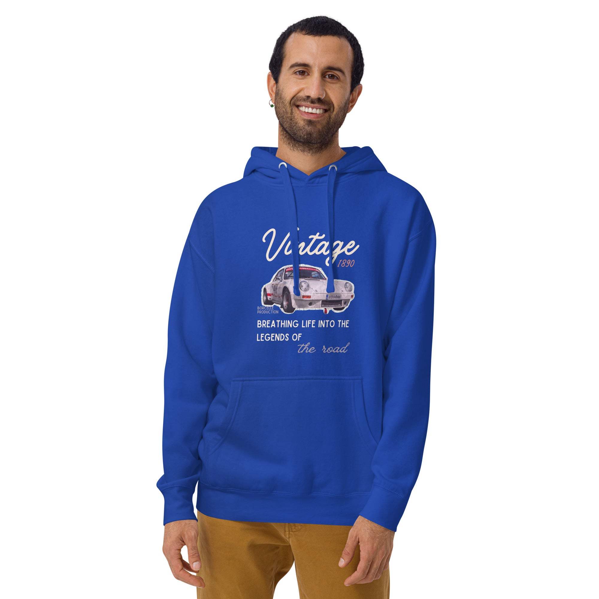Blue vintage car hoodie with retro graphic and script design worn by smiling man