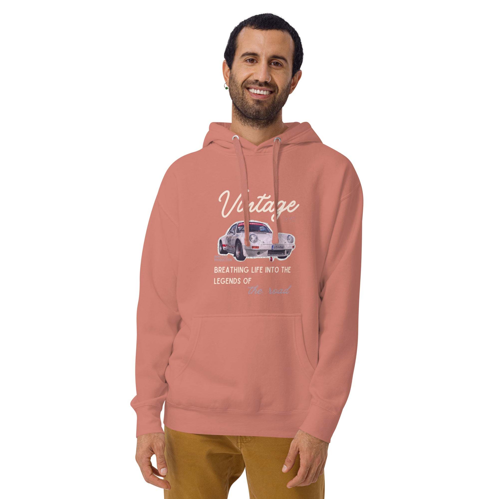 Man wearing a dusty rose vintage car hoodie with classic car graphic and script design, showcasing retro style and comfort