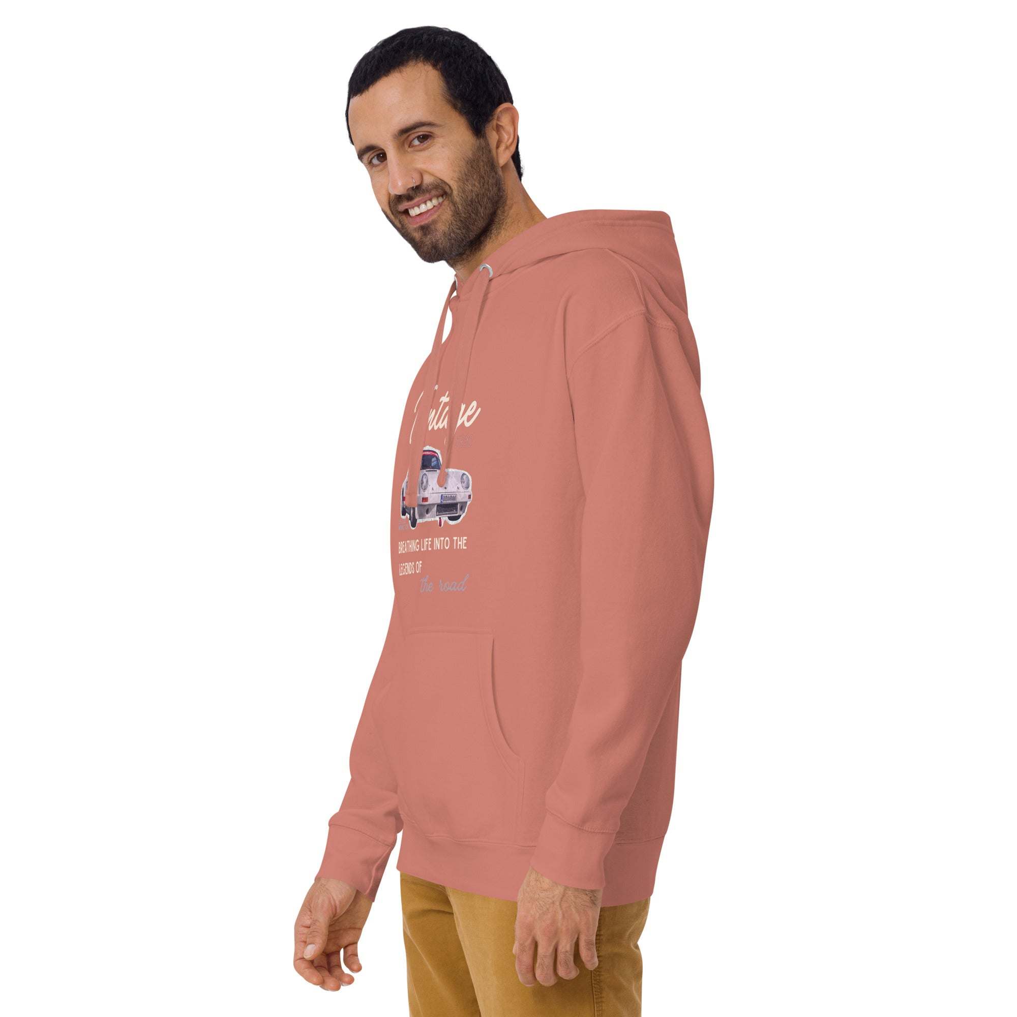 man wearing a dusty rose vintage car hoodie with front pocket and adjustable hood displaying classic car graphic