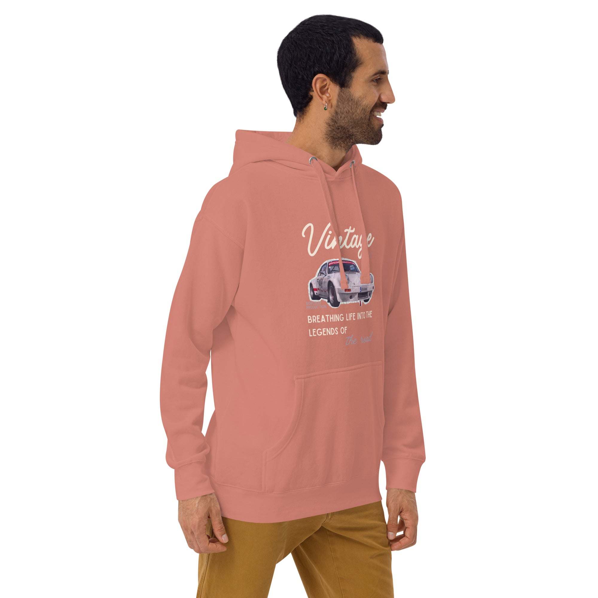 Man wearing a pink vintage car hoodie with classic car graphic and script design