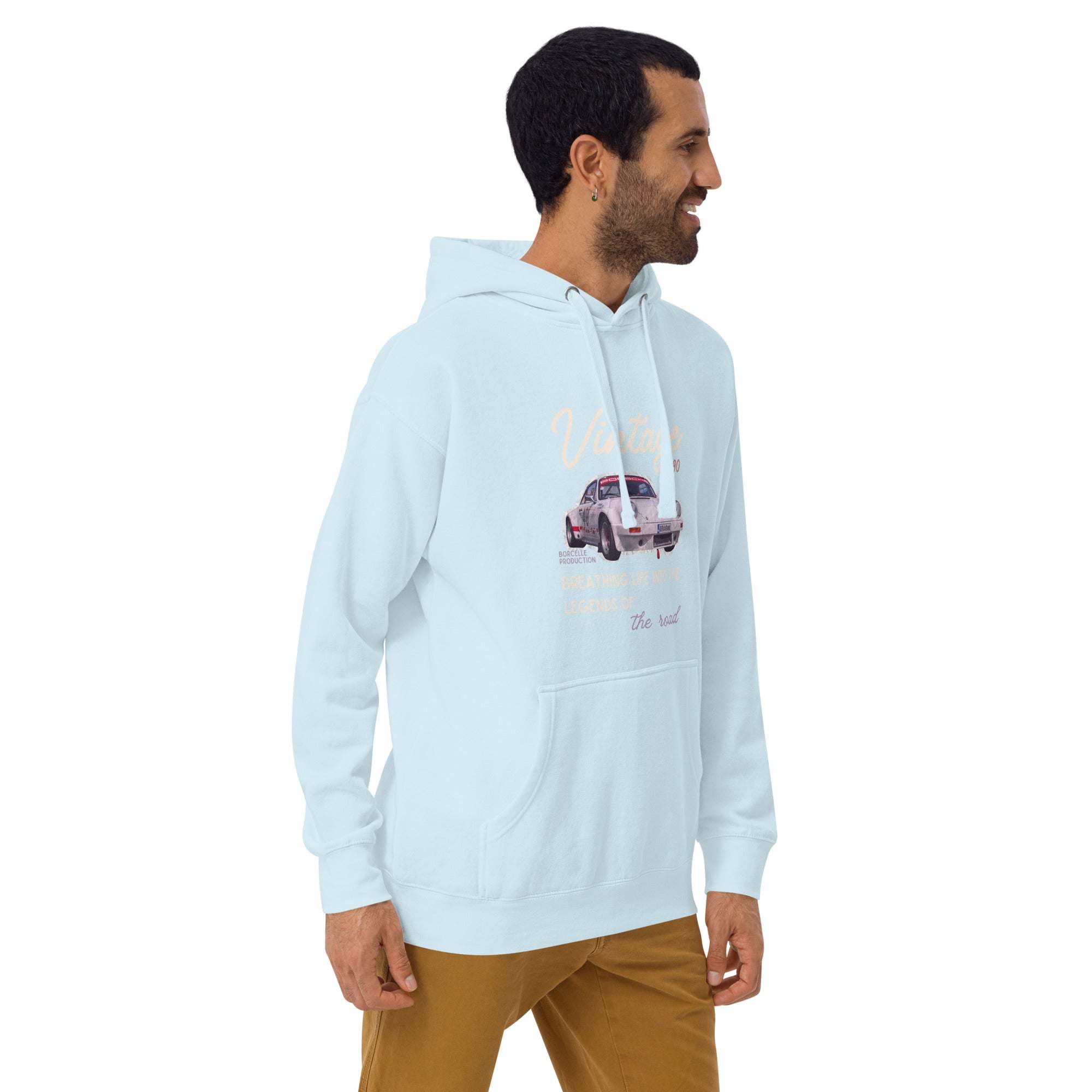 Light blue vintage car hoodie with classic car graphic worn by smiling man