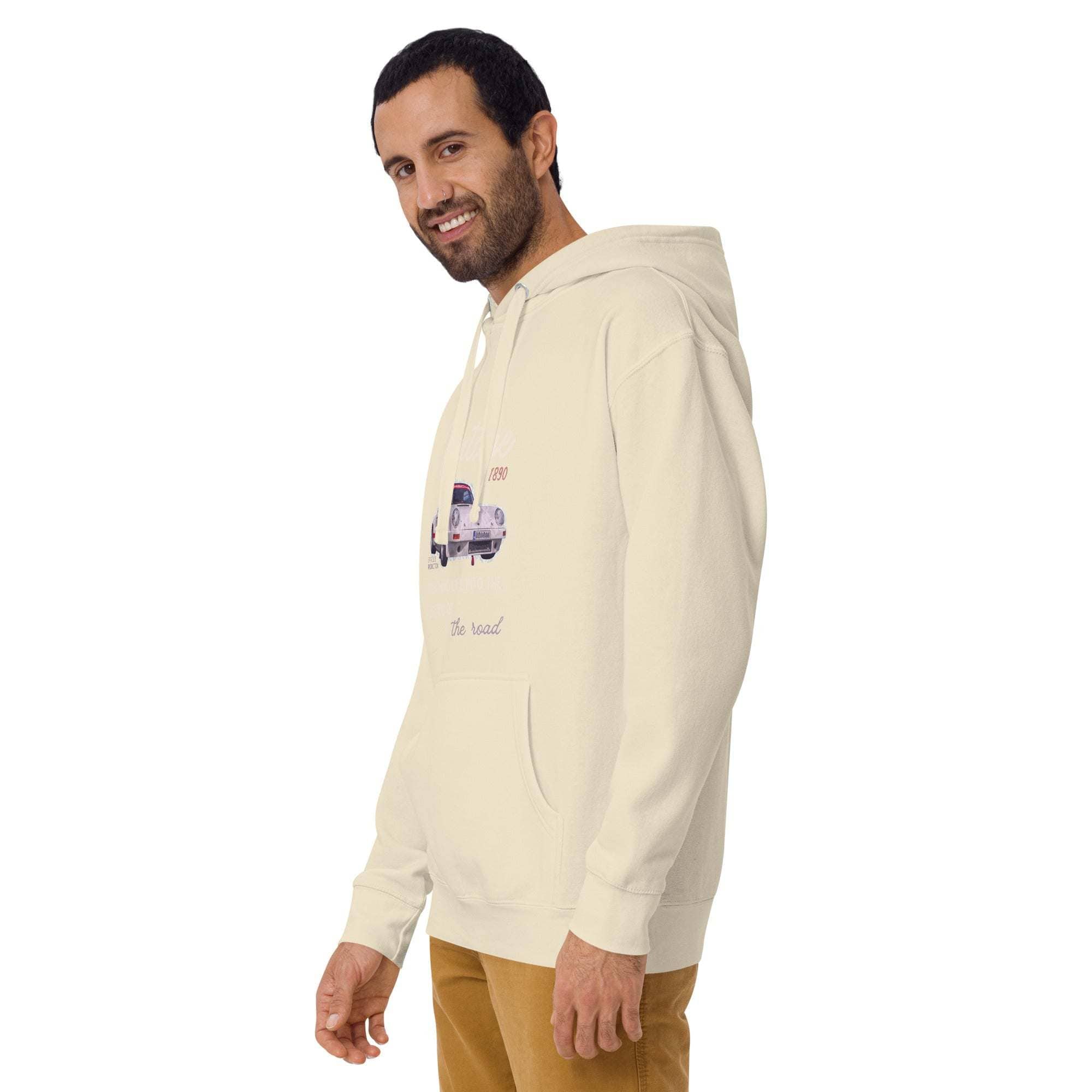 Man wearing cream vintage car hoodie with retro car graphic and kangaroo pocket