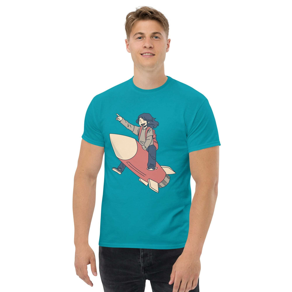 Man wearing teal Rocket Ride T-Shirt with retro cartoon rocket ride graphic and unisex fit
