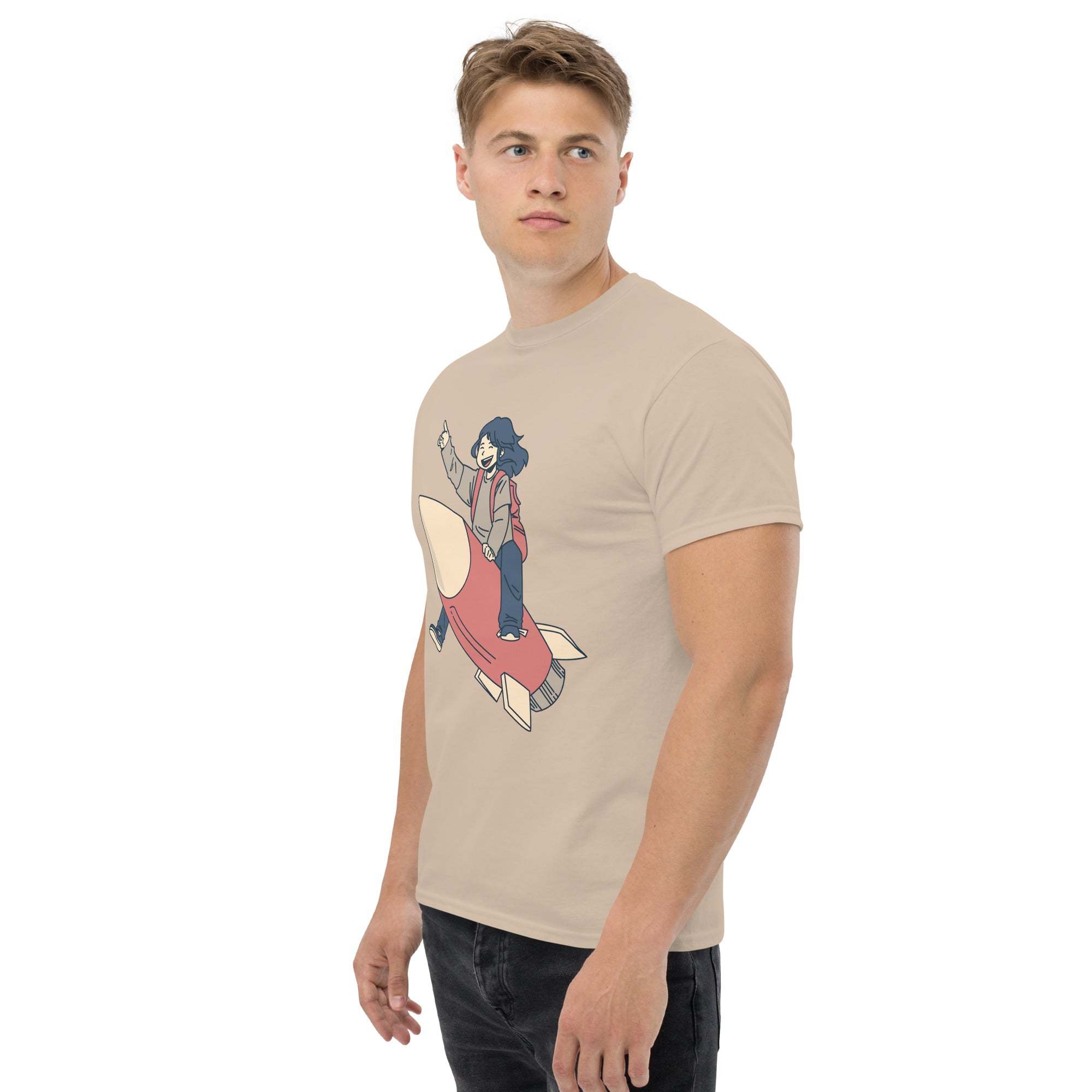 Man wearing beige Rocket Ride T-Shirt with retro cartoon rocket and character graphic design