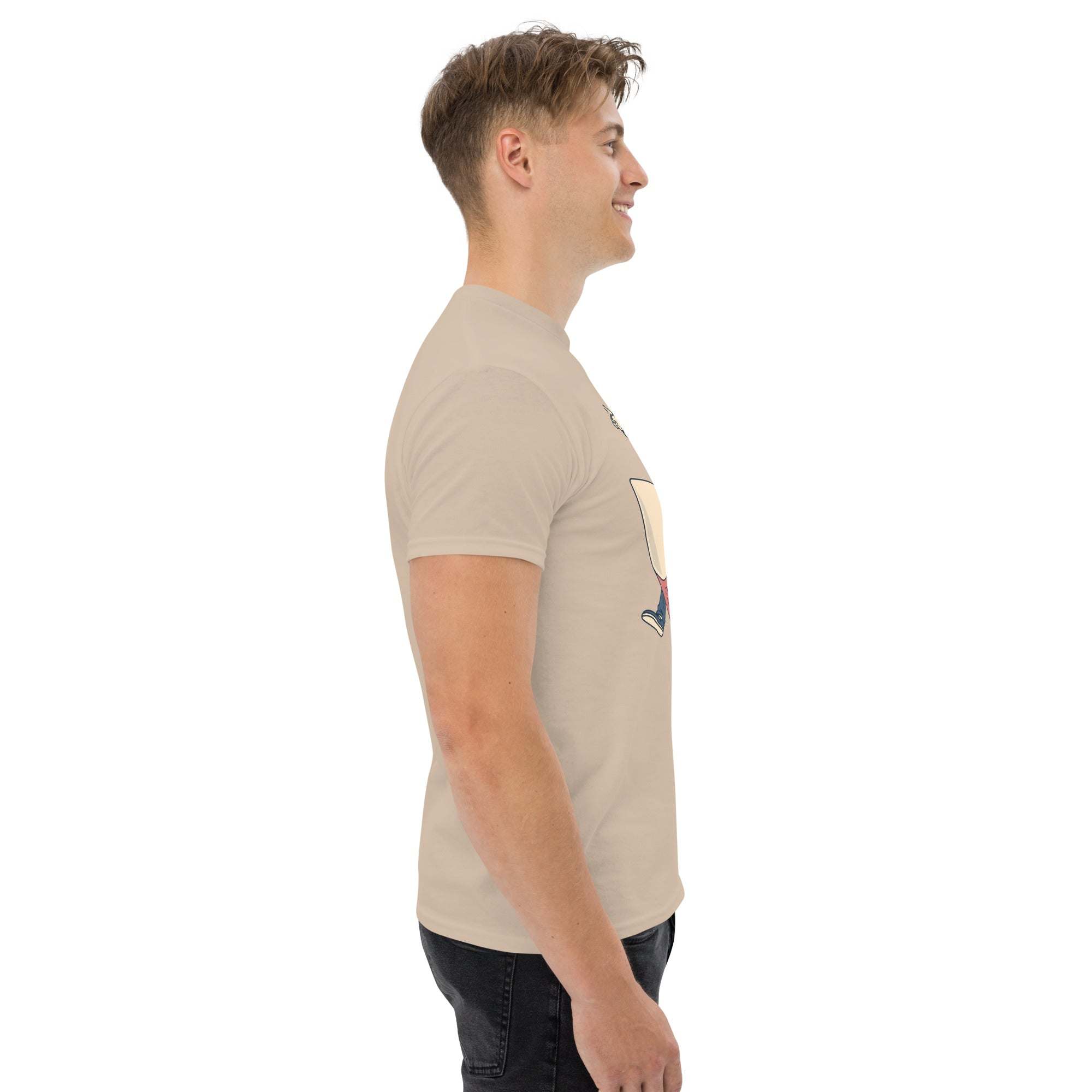 Side view of a man wearing beige Rocket Ride T-Shirt with retro cartoon space adventure graphic, unisex fit