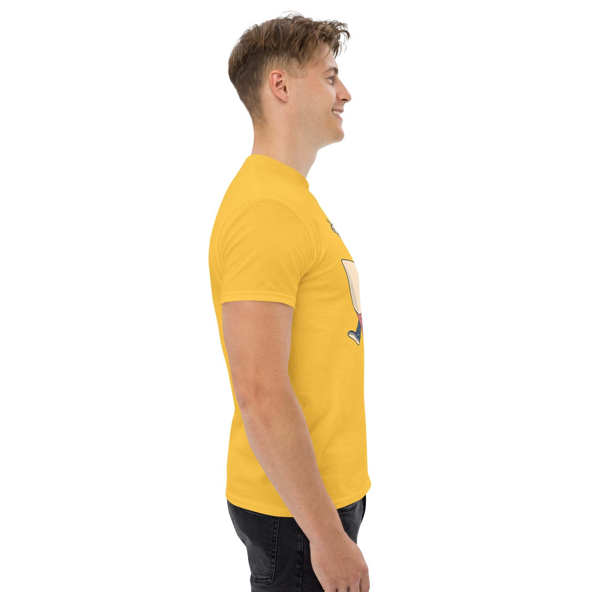Side view of man wearing yellow Rocket Ride T-Shirt with retro cartoon astronaut graphic