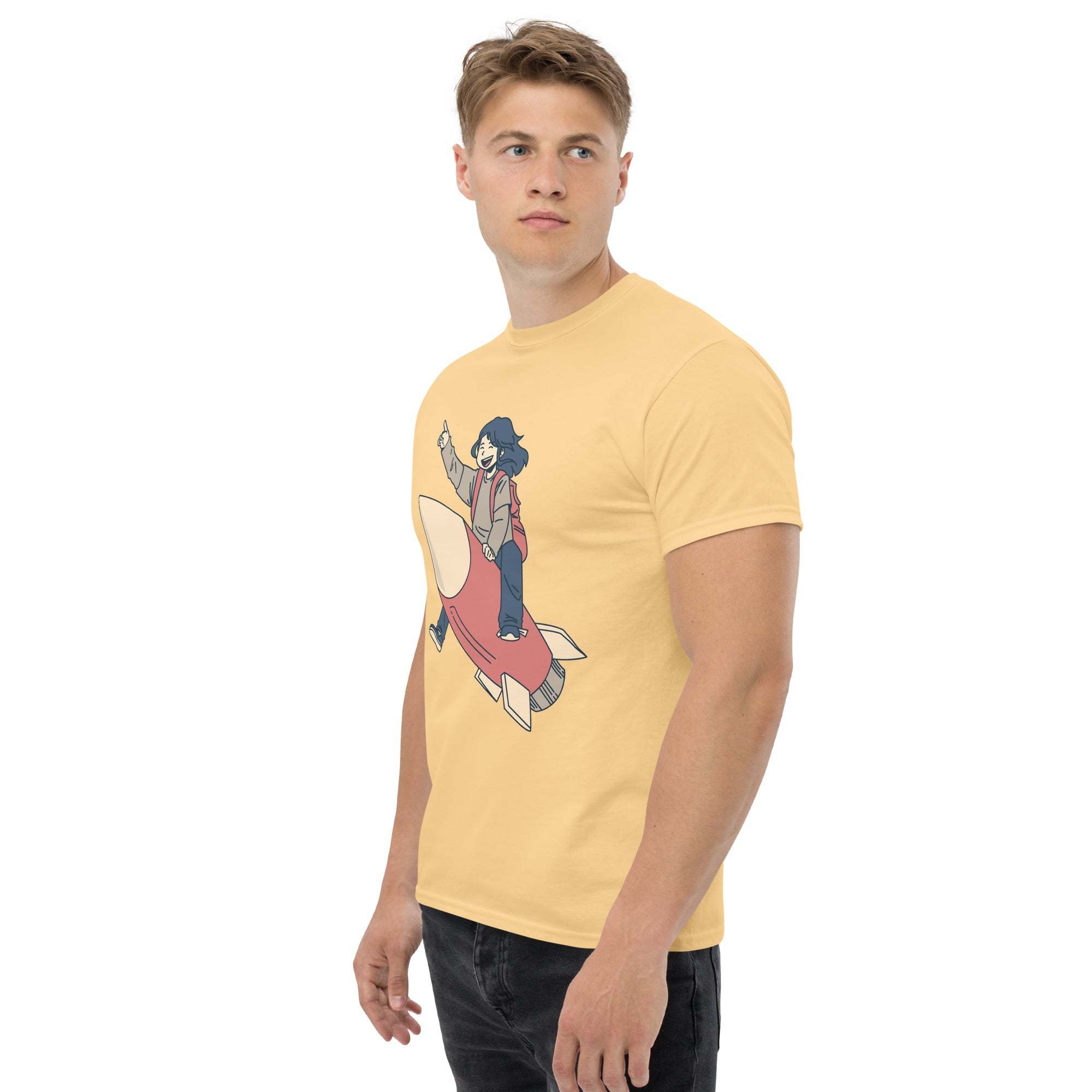 Man wearing yellow Rocket Ride T-Shirt with retro cartoon rocket and astronaut design, unisex fit