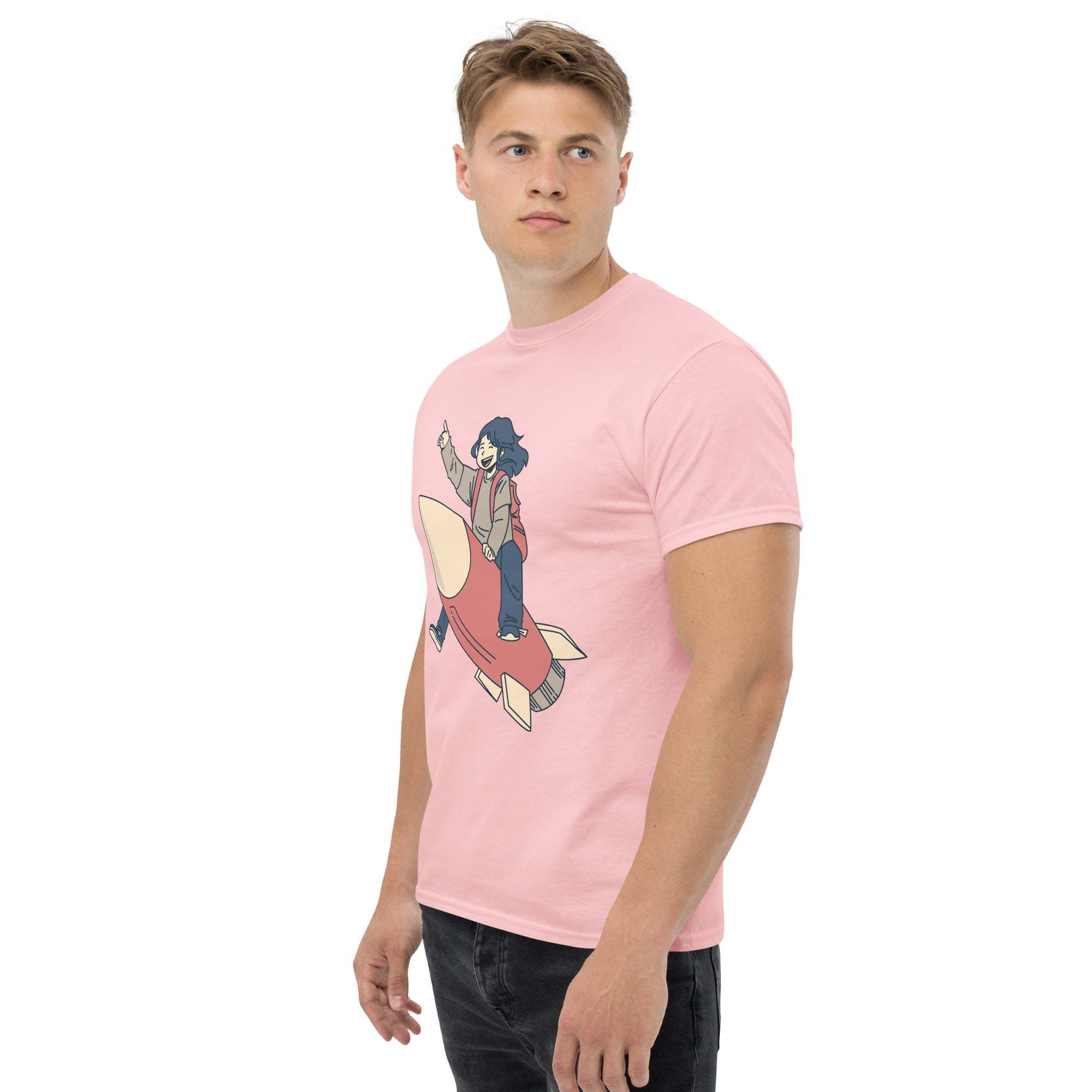 Man wearing pink Rocket Ride T-Shirt with retro cartoon astronaut riding a rocket graphic