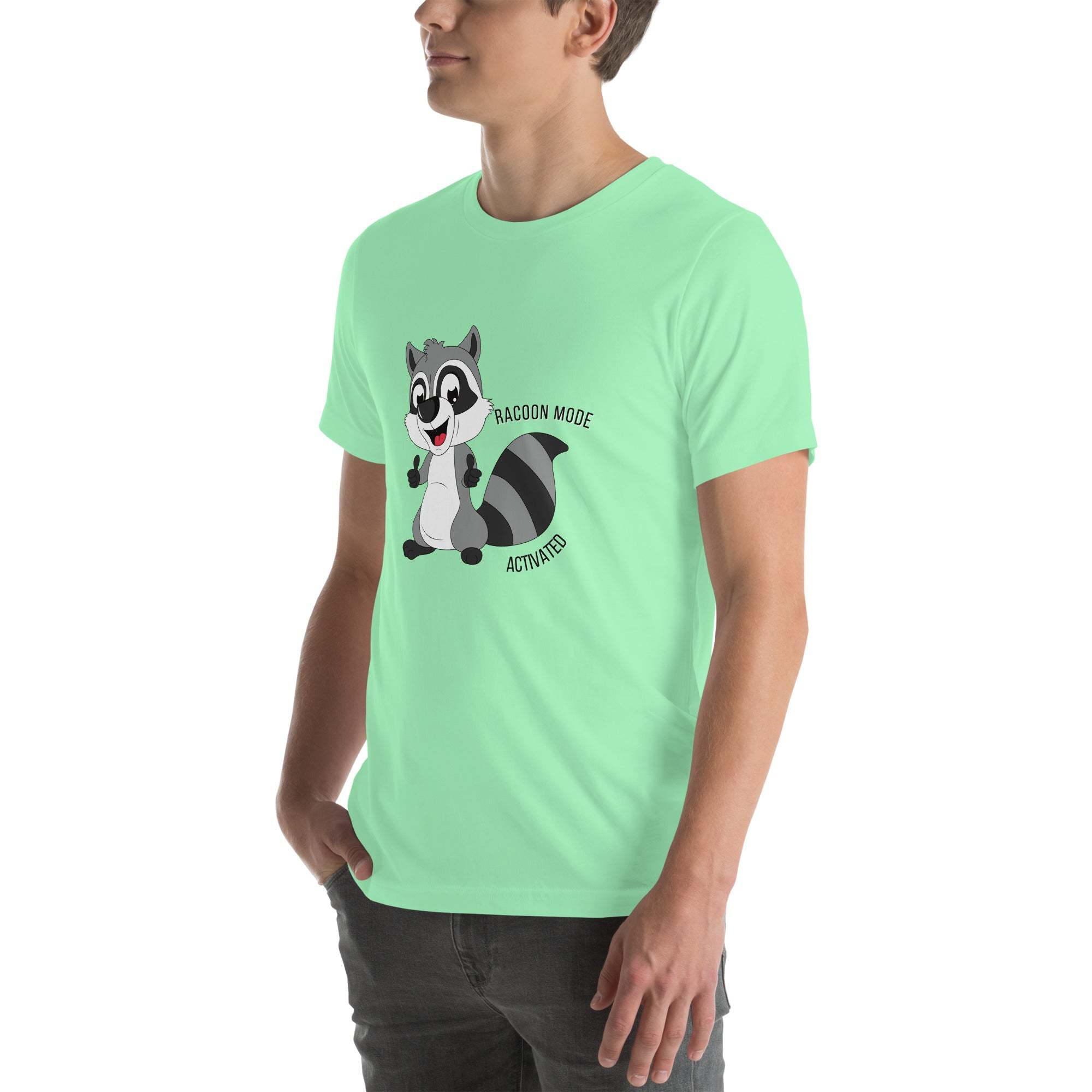 Man wearing mint green Raccoon Mode T-Shirt with cartoon raccoon and text "Raccoon Mode Activated"