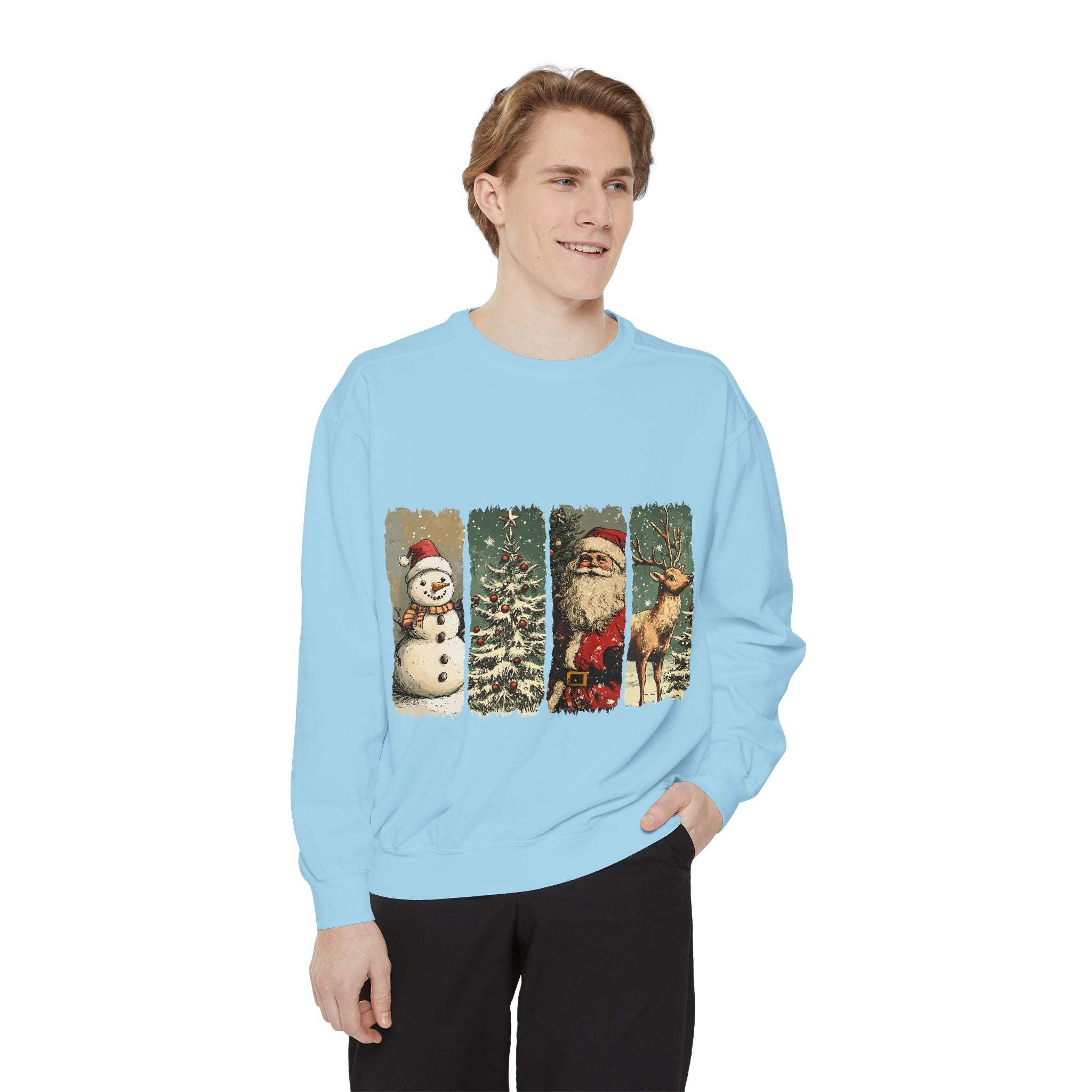 man wearing light blue vintage Christmas sweatshirt with watercolor snowman, Christmas tree, Santa Claus, and reindeer designs