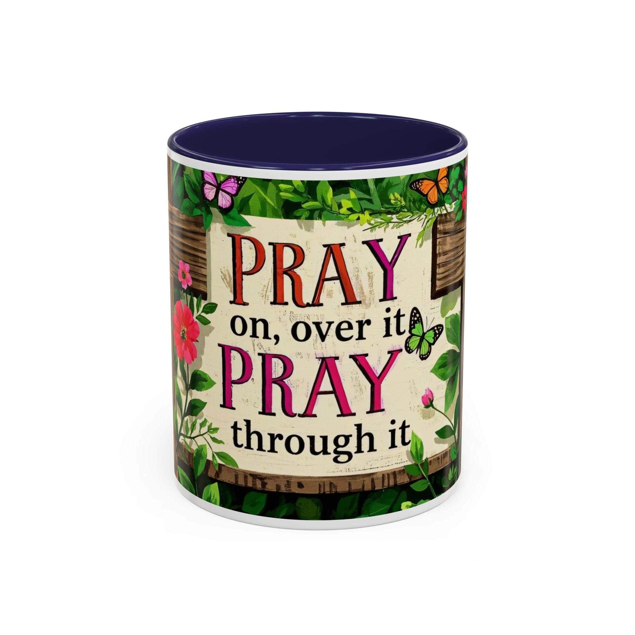 Mug with motivational quote 'Pray on, over it PRAY through it' and floral design.
