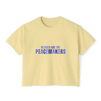 Women's boxy yellow tee with "Blessed are the Peacemakers" blue text, 100% cotton, vintage look