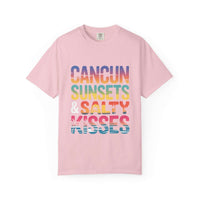 Pink t-shirt with colorful text 'Cancun Sunsets & Salty Kisses' on a white background