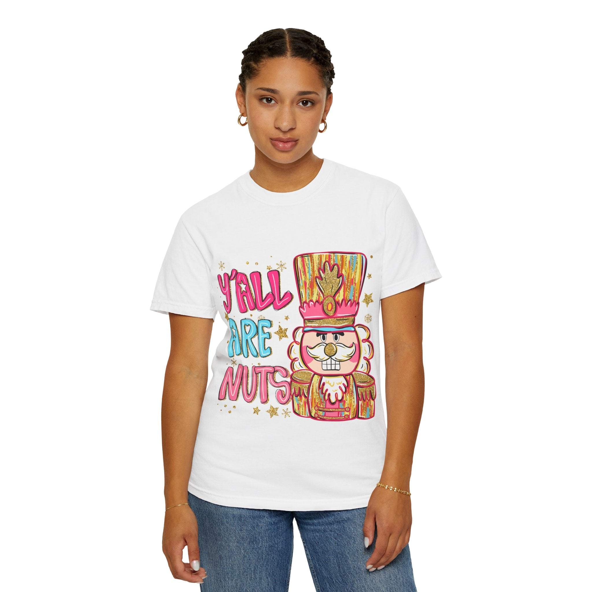 Woman wearing white Yall Are Nuts Nutcracker holiday graphic T-shirt