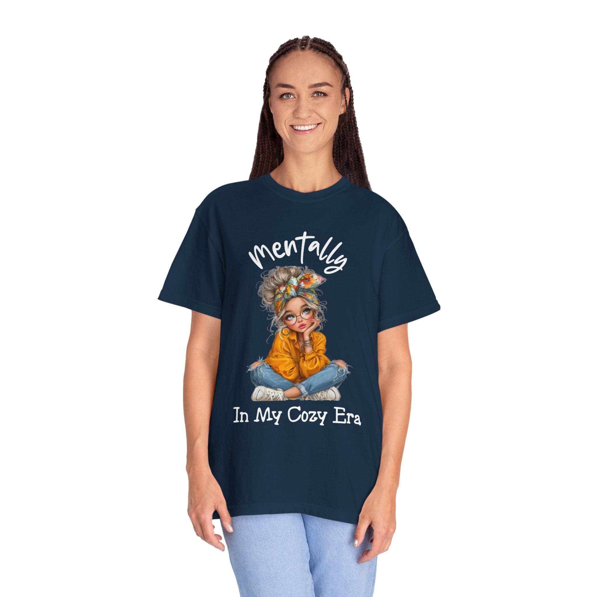 woman wearing navy "Mentally in My Cozy Era" soft cotton t-shirt with artwork of girl sitting cross-legged