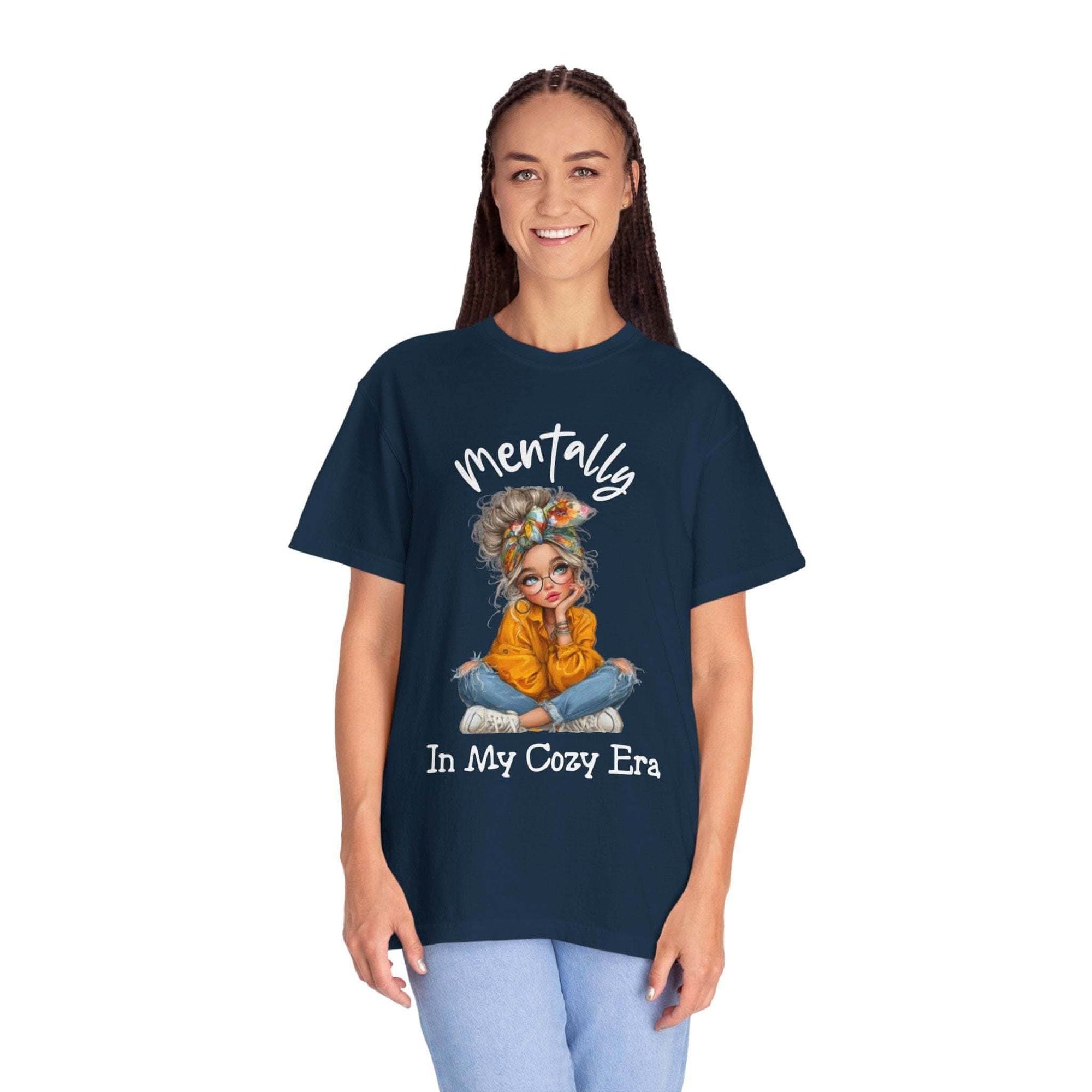 woman wearing navy "Mentally in My Cozy Era" soft cotton t-shirt with artwork of girl sitting cross-legged