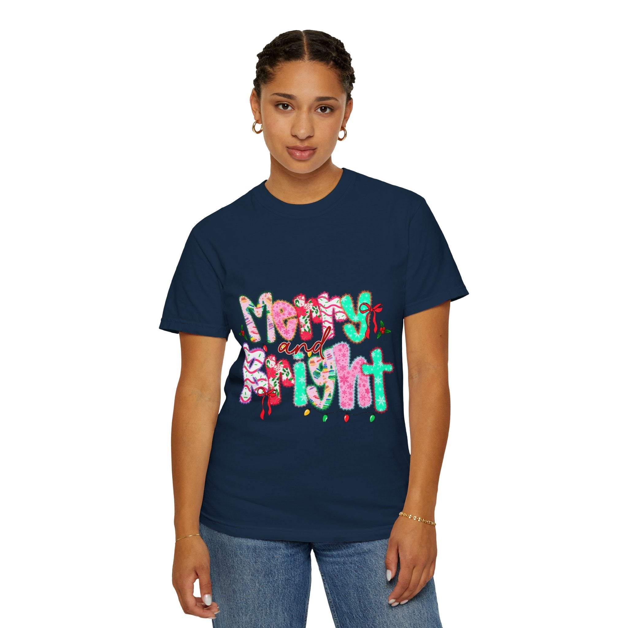 Woman wearing navy Merry and Bright T-shirt with colorful festive lettering on front
