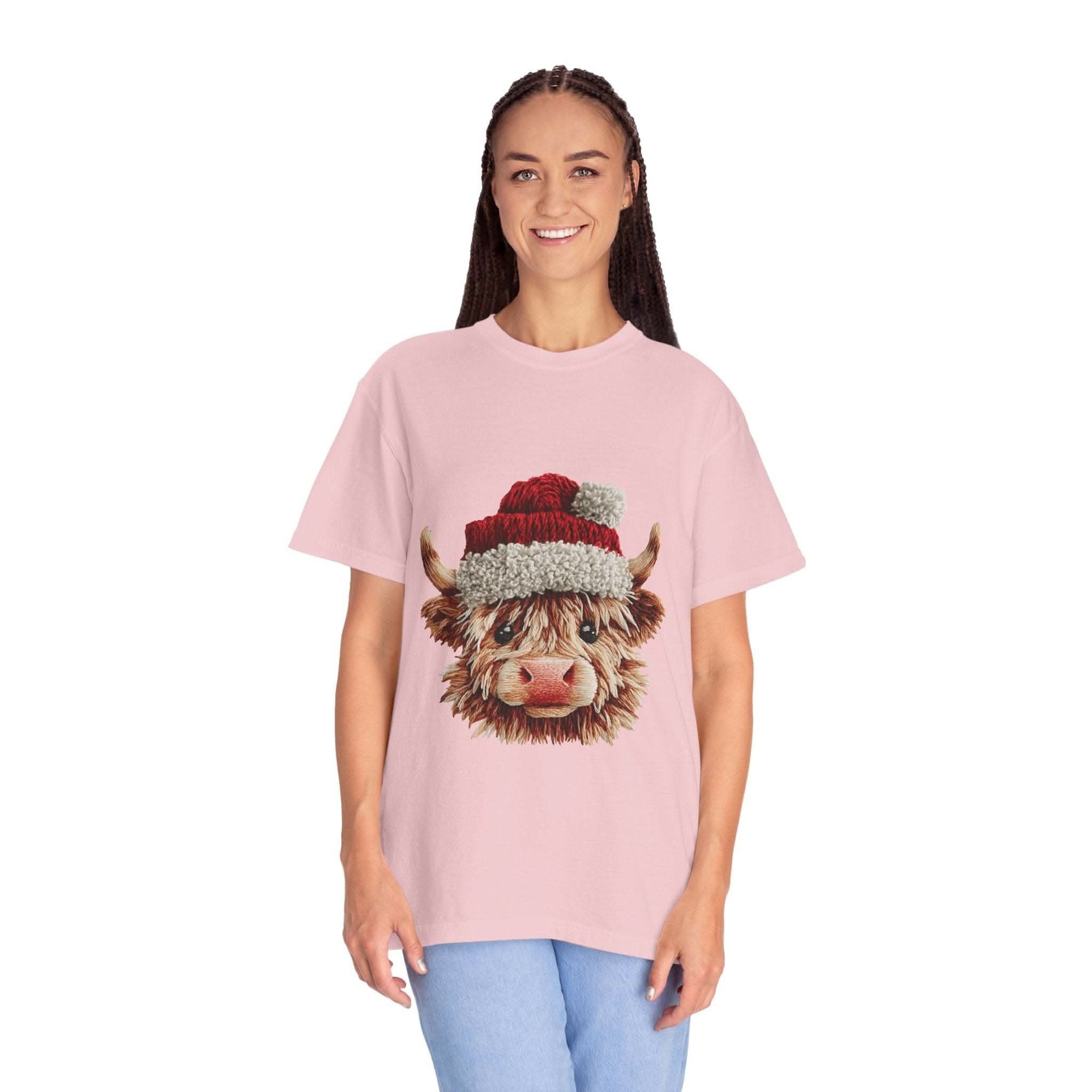 Black t-shirt featuring faux crochet yarn Highland cow Santa print by Printify, perfect for cozy Christmas wear.