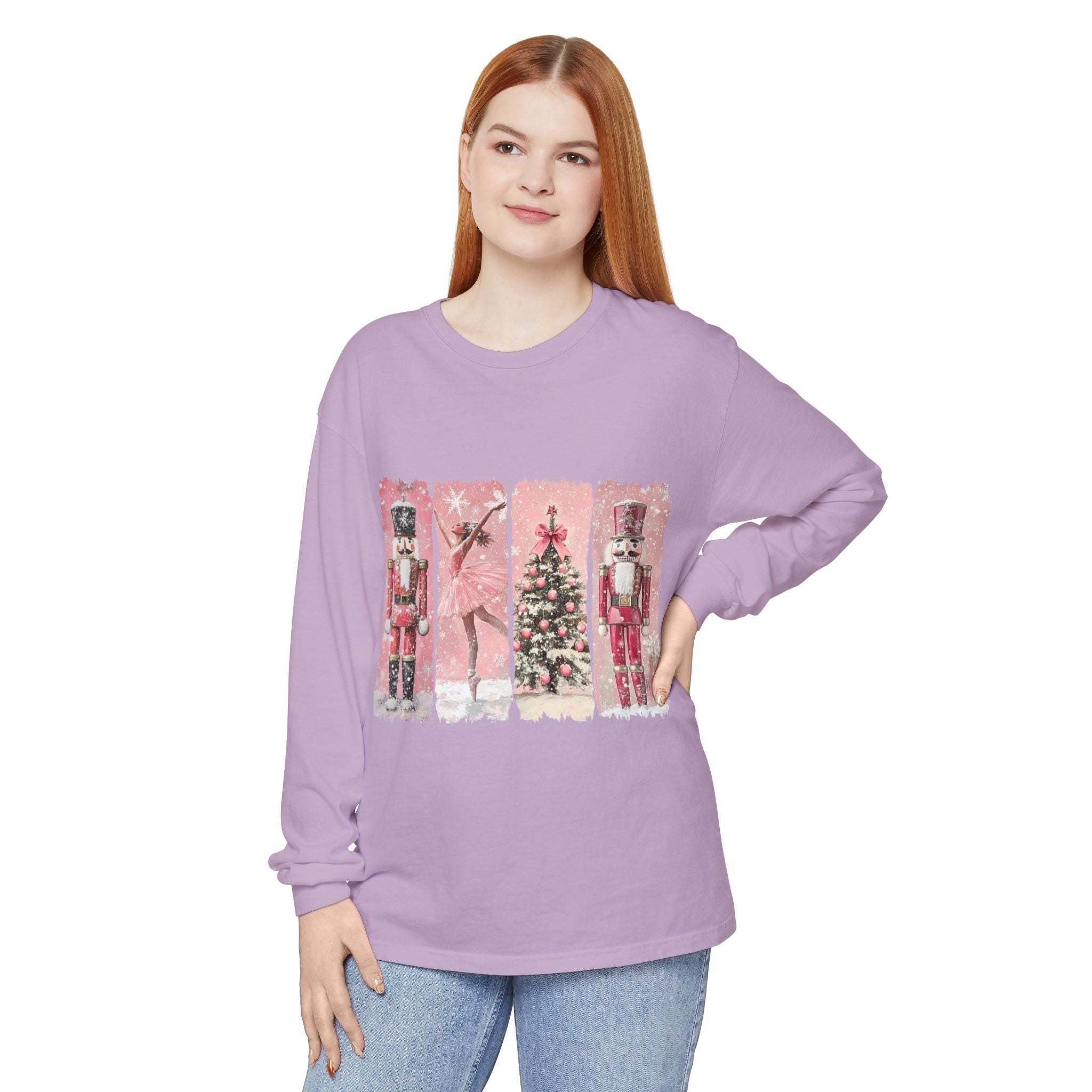 Preppy pink long sleeve t-shirt with watercolor Nutcracker and Christmas tree design, made of soft ring-spun cotton.