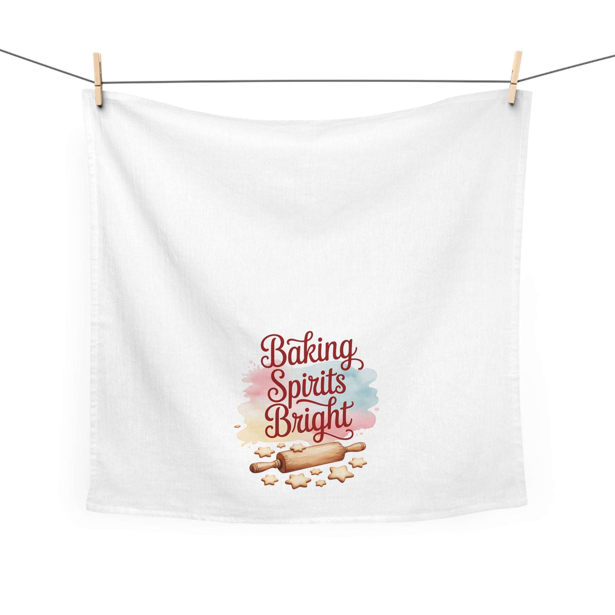 White kitchen towel with "Baking Spirits Bright" text, rolling pin, and cookie design, 100% cotton, festive holiday theme