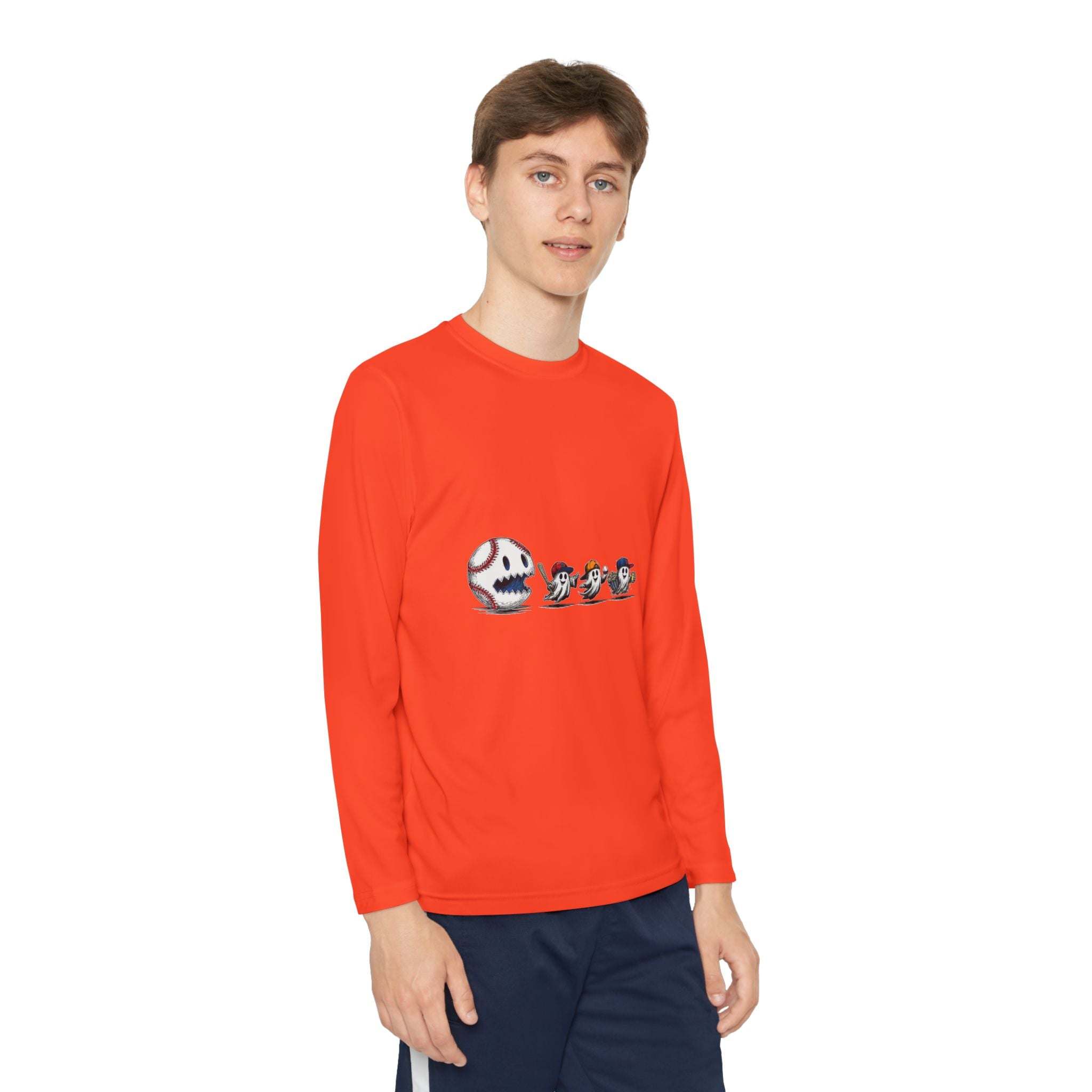 Youth Tee long sleeve shirt with baseball eating Halloween ghosts graphic in bright orange, moisture-wicking fabric for active wear.