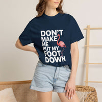 Dont Make Me Put My Foot Down flamingo T-shirt with bold white lettering and pink flamingo graphic on vintage dyed fabric
