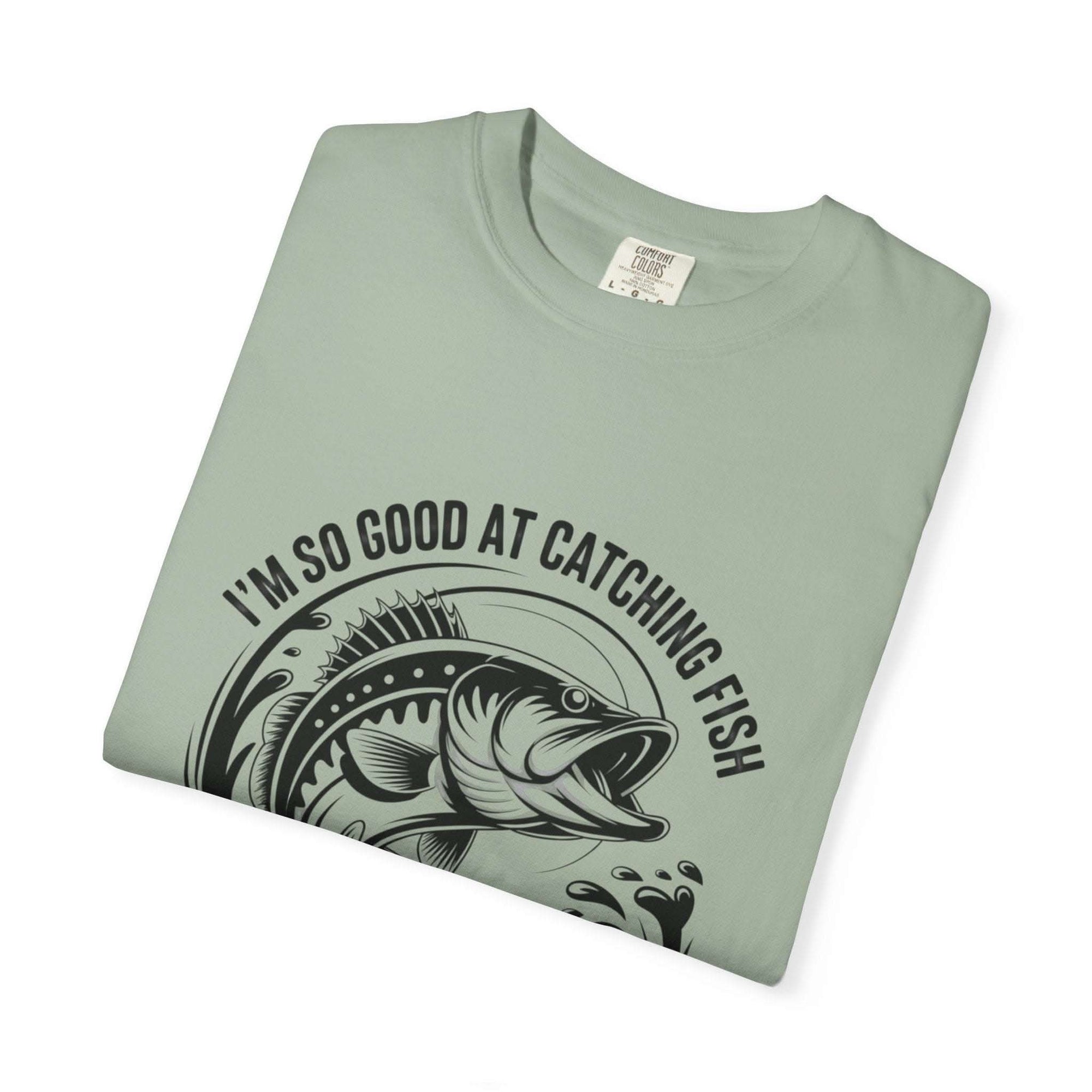 Fishing T-Shirt with "So Good At Catching Fish That The Fish Tell Stories About Me" text on relaxed-fit cotton tee