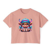 Women's boxy tee with moody girl highland cow graphic on pink cotton fabric
