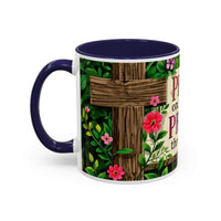 Mug with floral design and cross on a white background