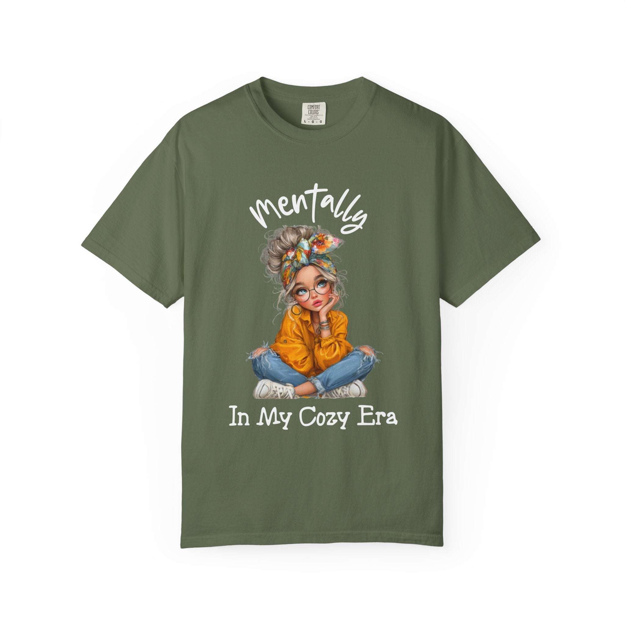 Mentally in my Cozy Era green t-shirt with graphic of a girl sitting cross-legged wearing glasses and a headband