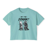 Light blue women's boxy tee with "Am I The Drama?" raccoon graphic and vintage pigment dye finish