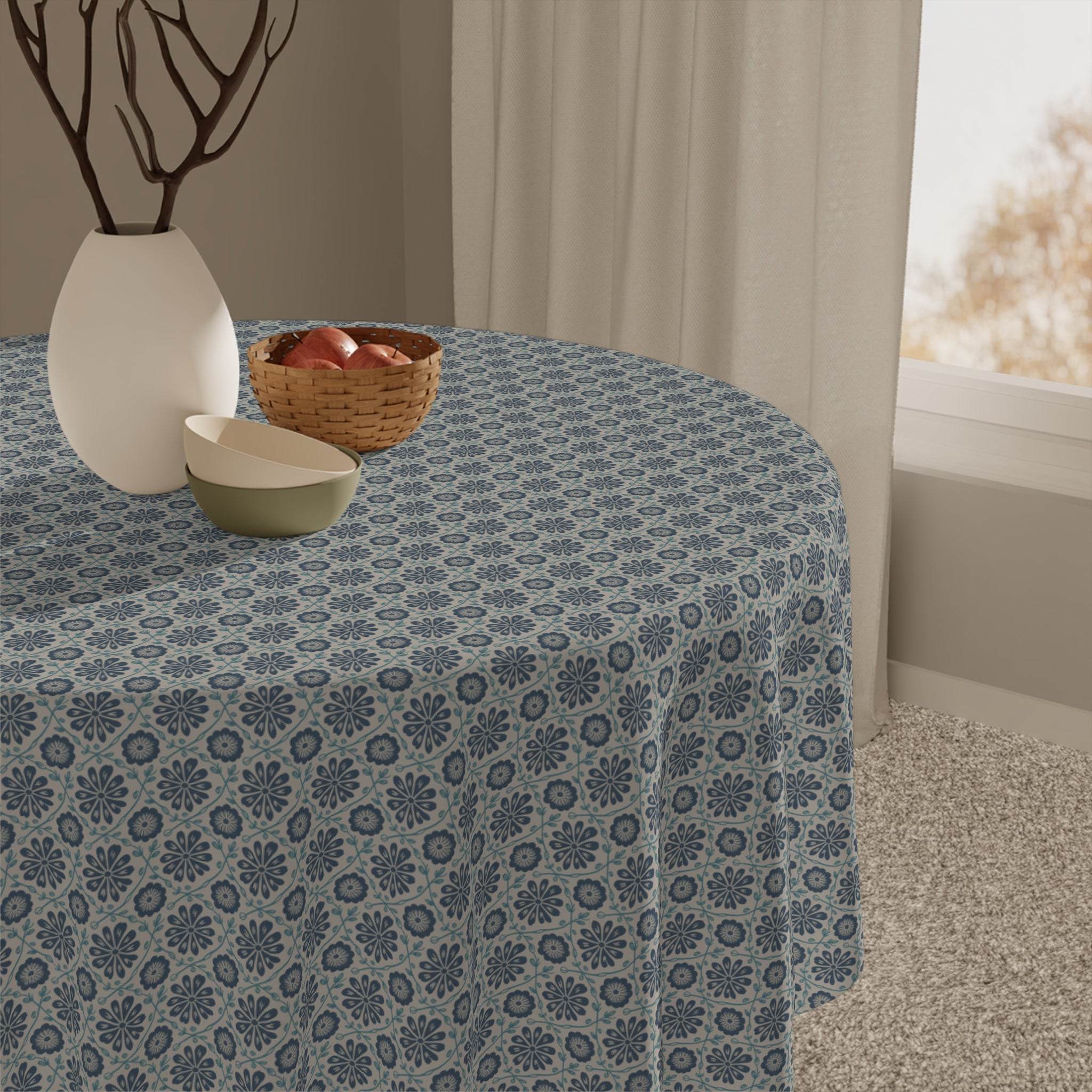 round table with indigo floral patterned tablecloth in dining room setting