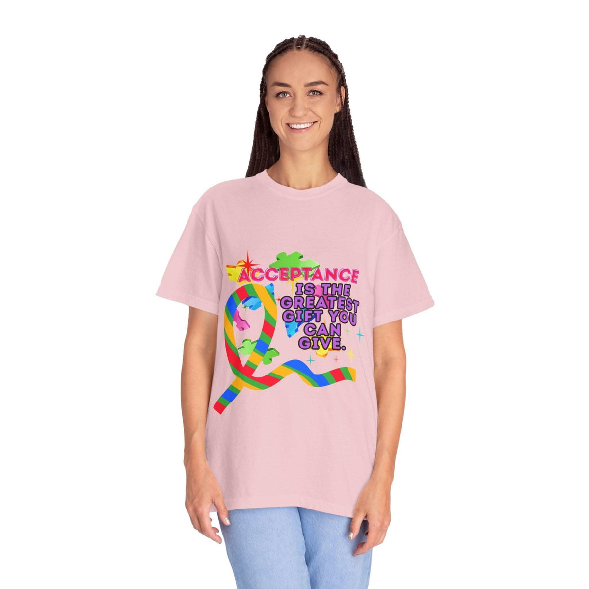 Woman wearing pink garment-dyed T-shirt with autism acceptance design and supportive message