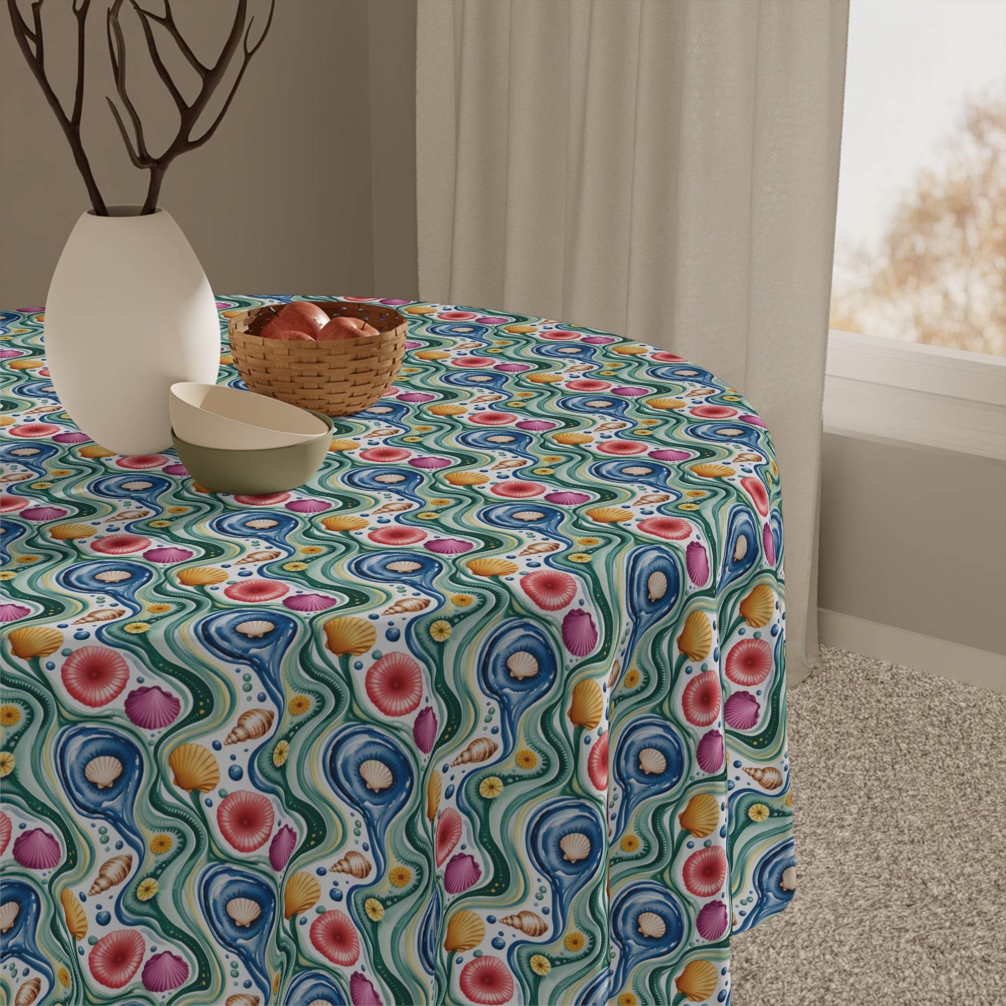 Round table with vibrant Tablecloth Coastal Shells featuring colorful seashell patterns in a bright coastal design
